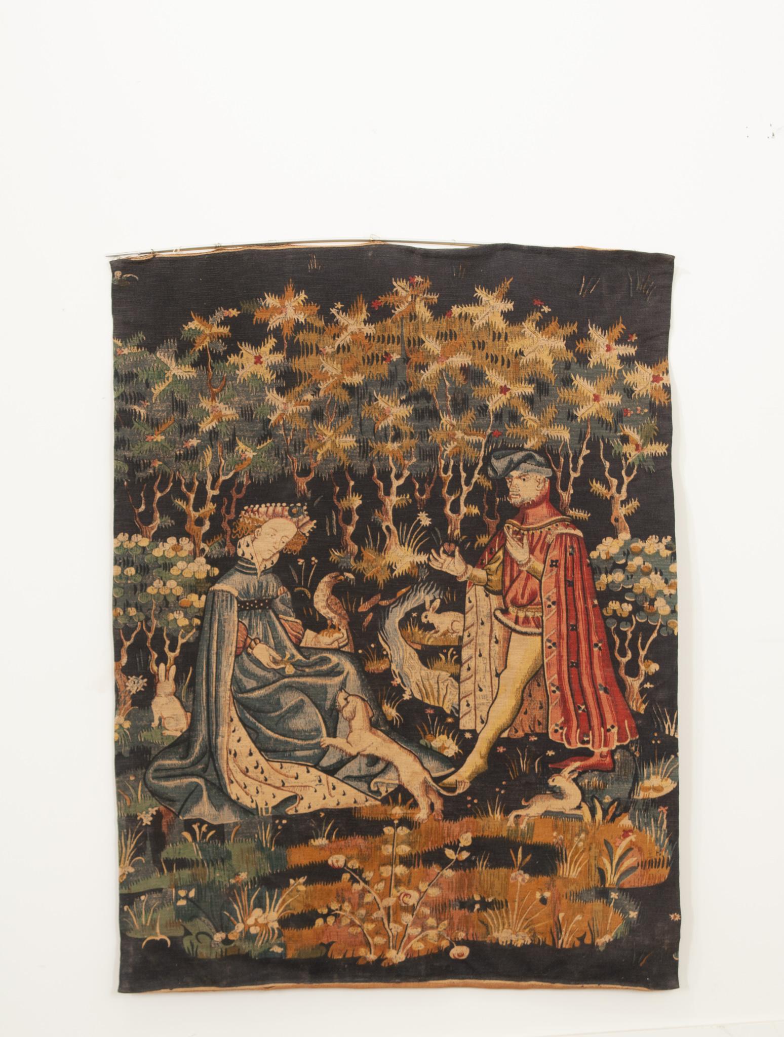 This wonderful French tapestry from the 20th century is a reproduction of one of the most recognizable tapestries of the Middle Ages. The original, named “An Offering of the Heart”, was crafted in the 15th century by an unknown Flemish artist and is