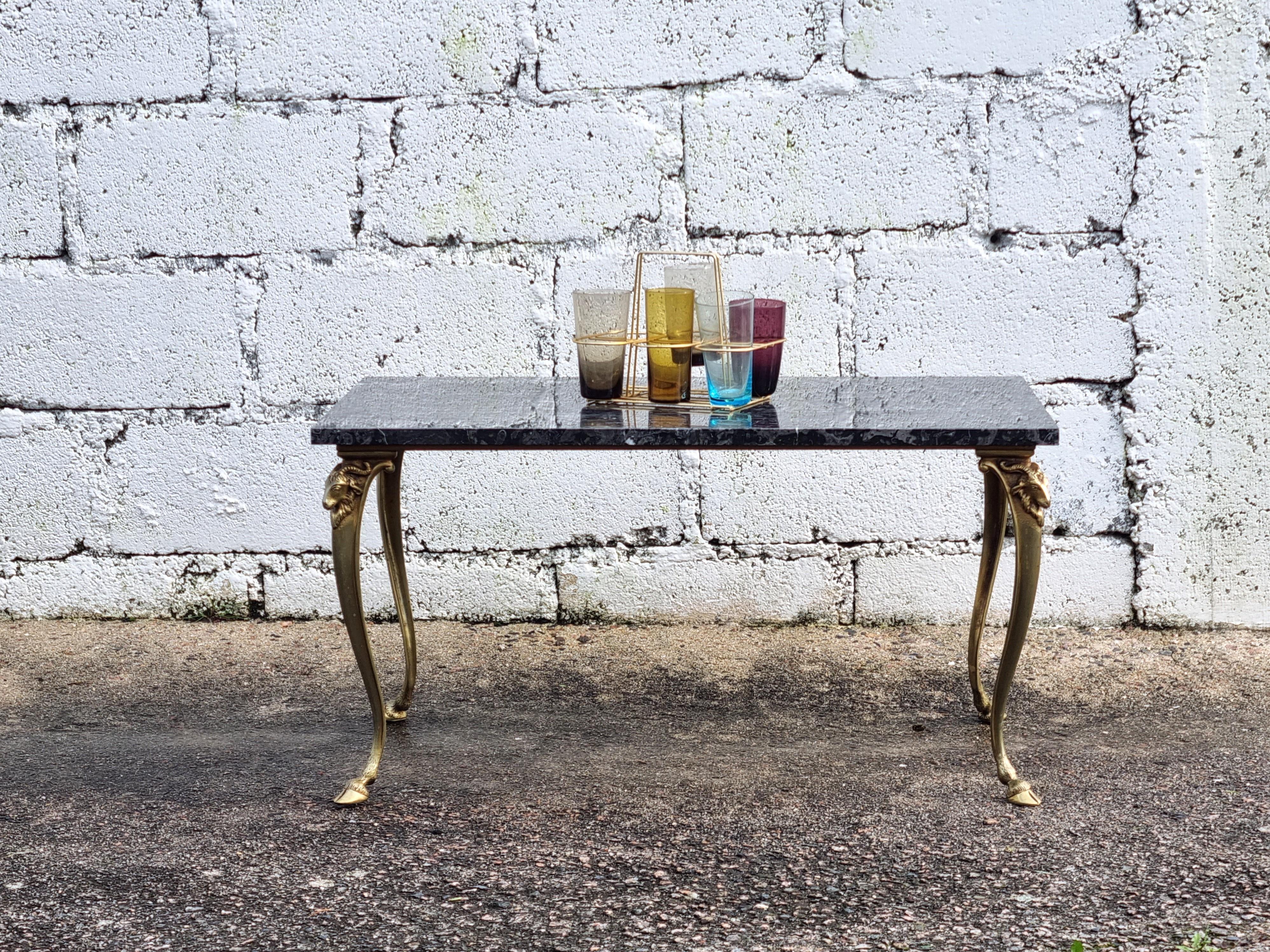 French Vintage black Marble and Bronze Coffee Table -Vintage Cocktail Table - Style Louis XVI from the 60s

Wonderful polished Marble Top with a beautiful play of colors in black, anthracite, gray and white
Noble golden Bronze-Steel Frame - very