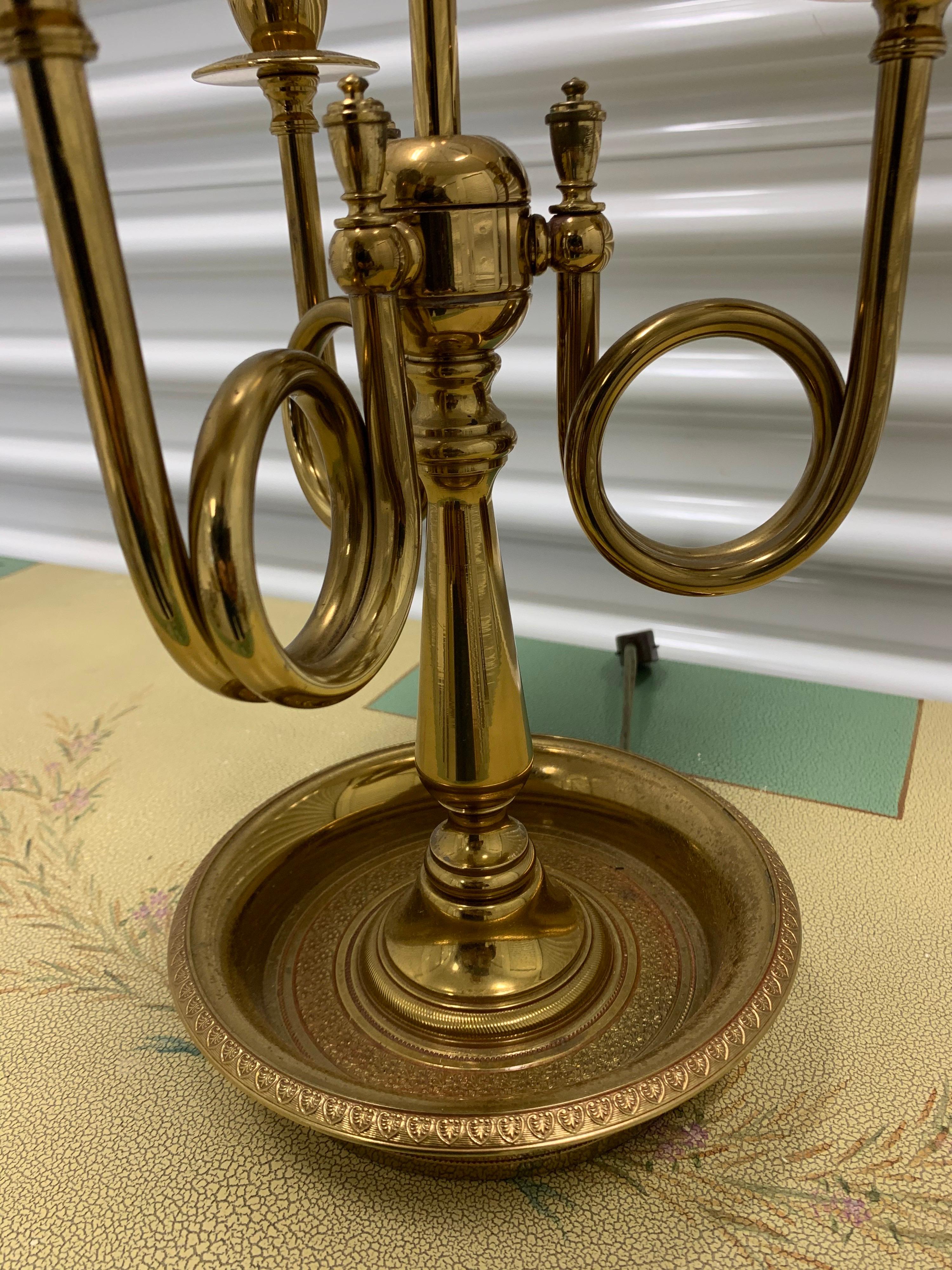 Elegant French brass Bouillotte table lamp with original metal shade. Iconic in every way. Fully electrified
and wired for USA and featuring three lights.