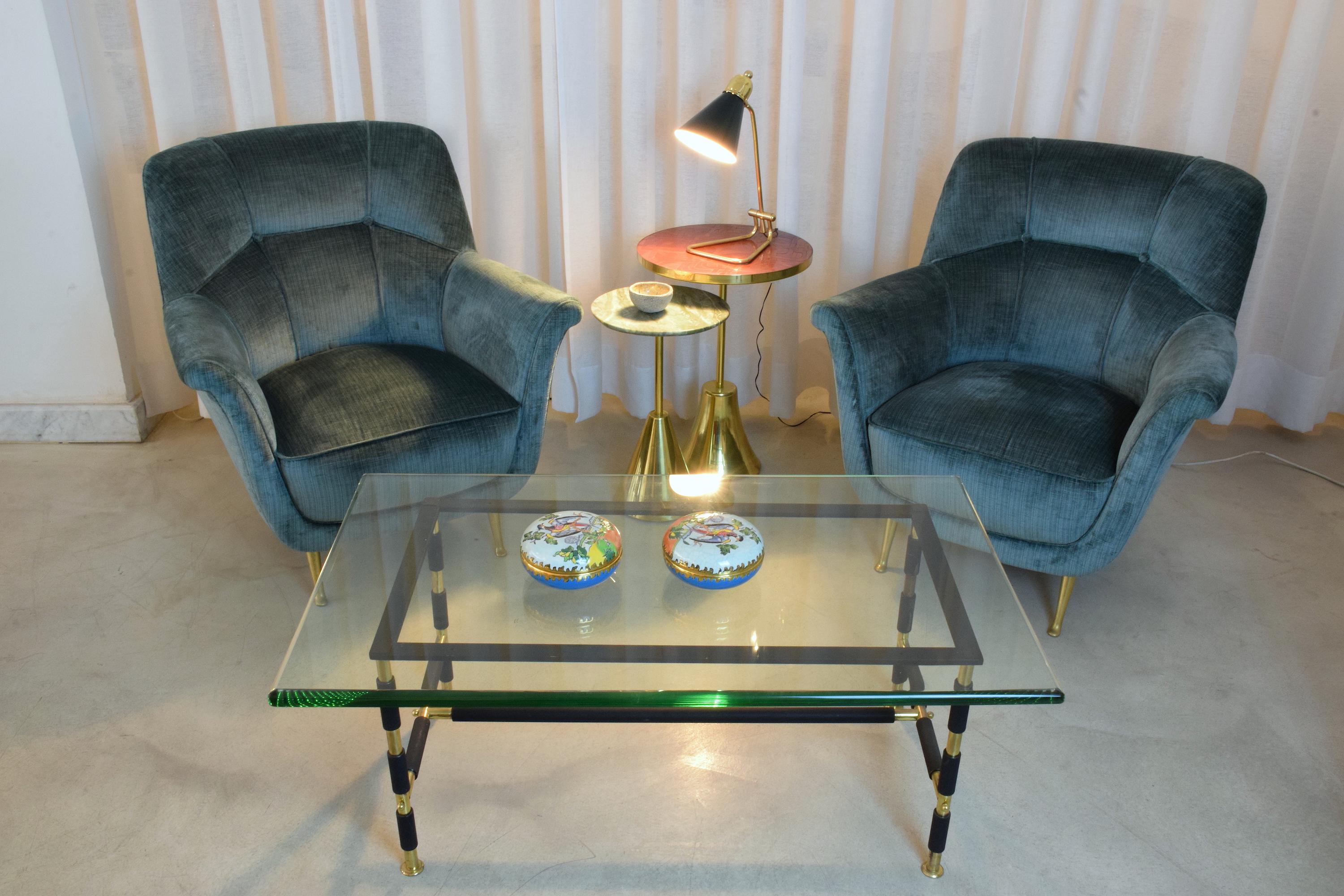 A 20th century vintage table, desk or accent lamp designed by the iconic French designer Robert Mathieu in the 1950s. The lamp is adjustable at the shade which has been fully restored through brass polishing and re-lacquering of the shade. The brass