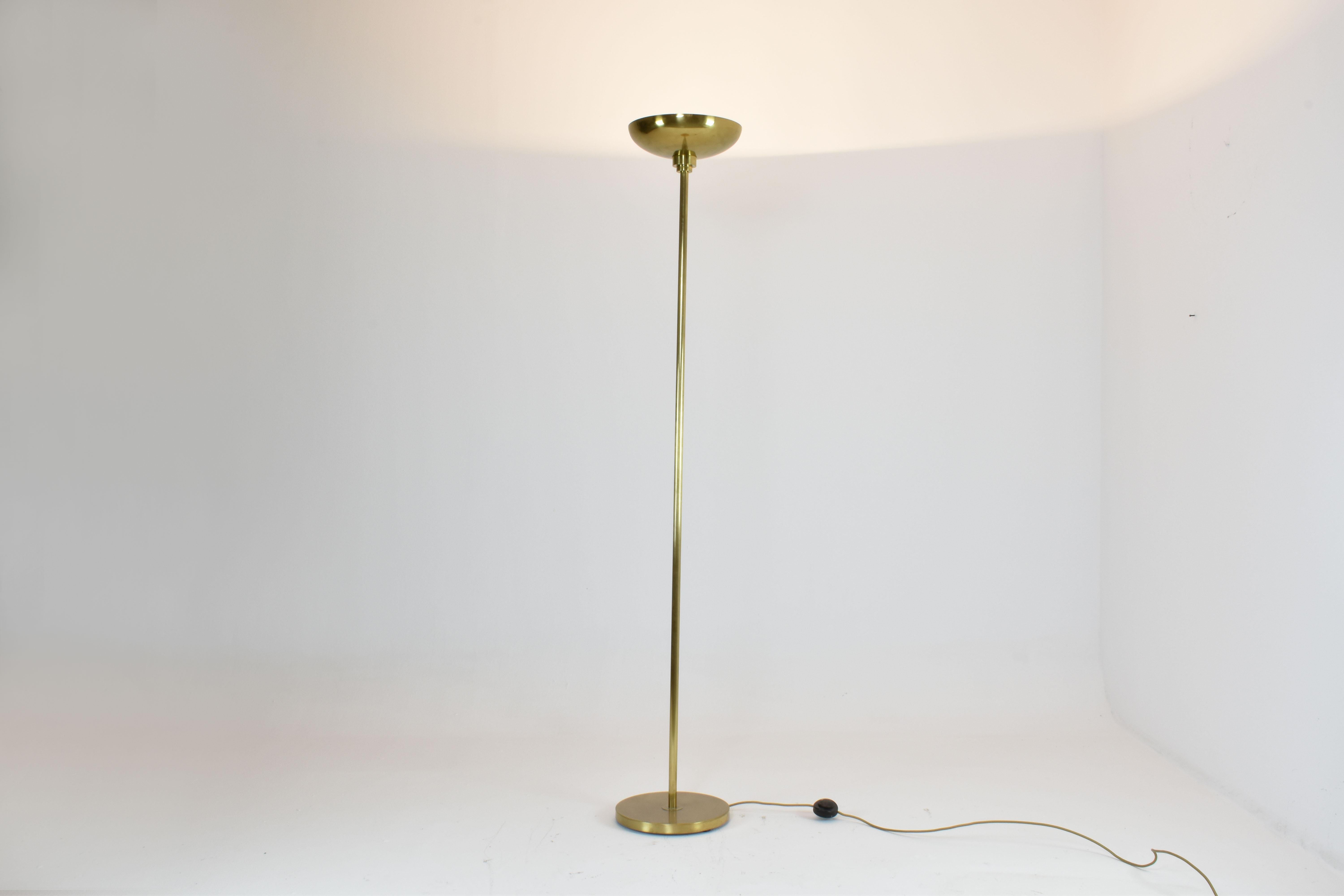 A sleek and sculptural French floor lamp, crafted entirely in solid brass with a minimalist silhouette that pays tribute to Art Deco purity. 
Why we love it:
Timeless yet bold, it works just as beautifully in a classic living room as in a
