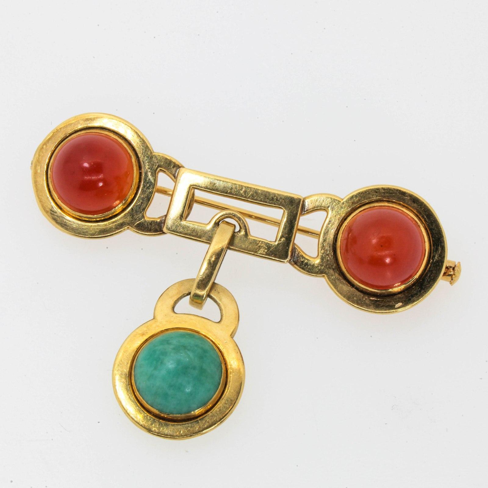 One of a kind, Mid Century French brooch created in 18KT yellow gold, featuring two cabochon cut Carnelians and one green Quartz.  The back and the pin are stamped with the French Owl hallmark, and it measures  2 1/4 inch  long by 11/16  inch high. 