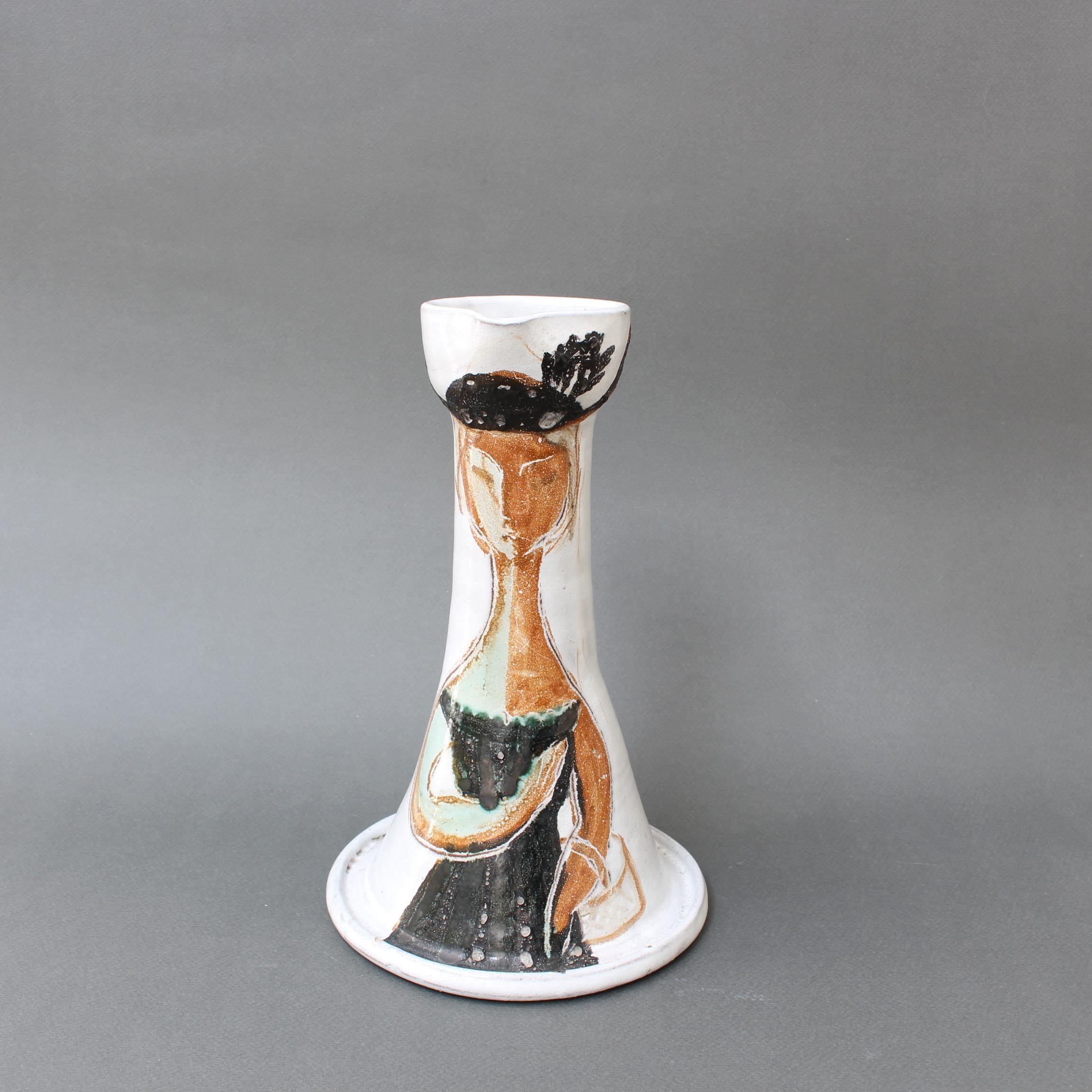 French mid-century ceramic lamp base by Atelier du Grand Chêne (circa 1950s). Painted with decor of a stylish woman in feathered cap and fashionable handbag, the piece is absolutely charming and delightfully representative of its era and Provençal