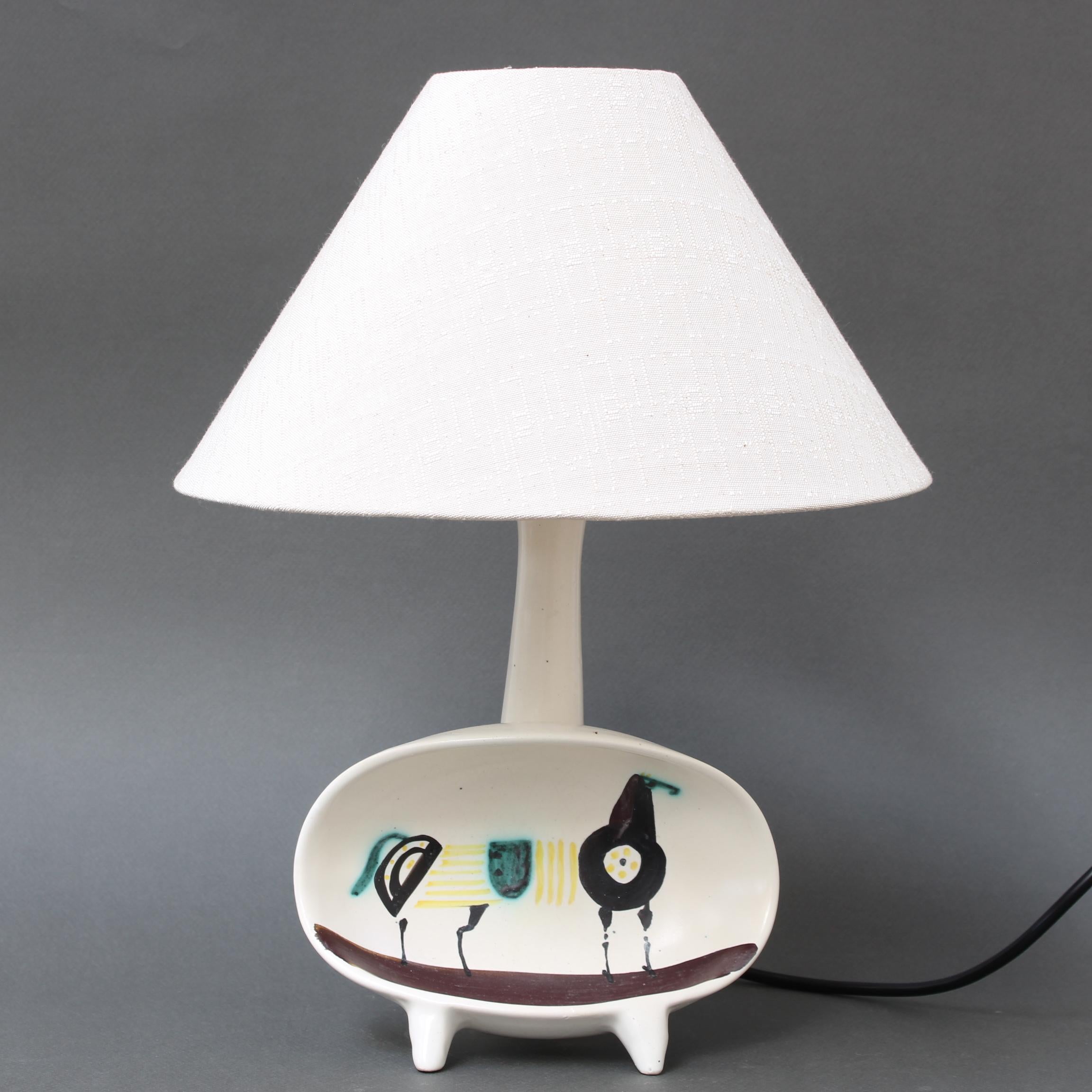 French decorative ceramic lamp with hand-painted horse by Roger Capron (circa 1950s). This is Capron's 'Coupe n°2 lamp' which is signed in the interior of the vertical base. A rare piece indeed, hand-painted with a stylised horse in his inimitable
