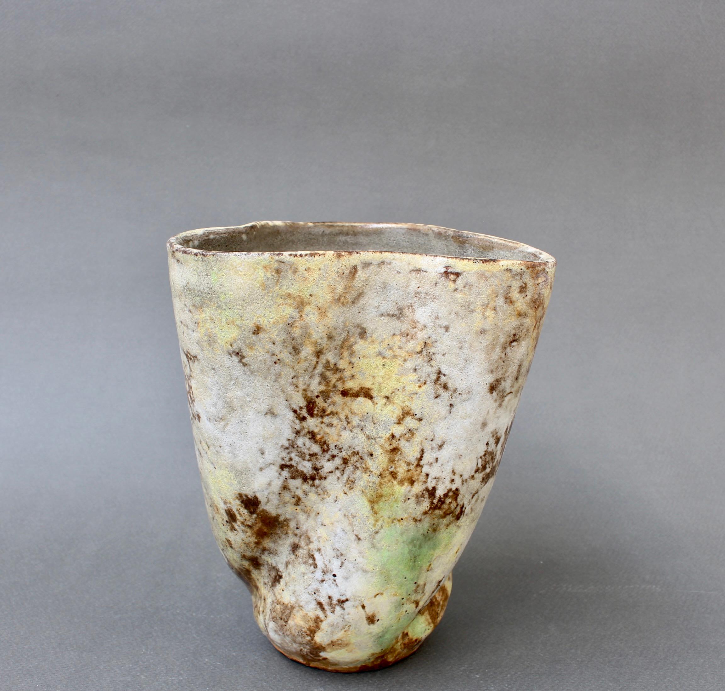 French Mid-Century ceramic flower vase by Alexandre Kostanda, Vallauris, France (circa 1960s). In his trademark natural clay and rustic style, Kostanda created beautifully original vessels, such as vases, pitchers and pots which were both