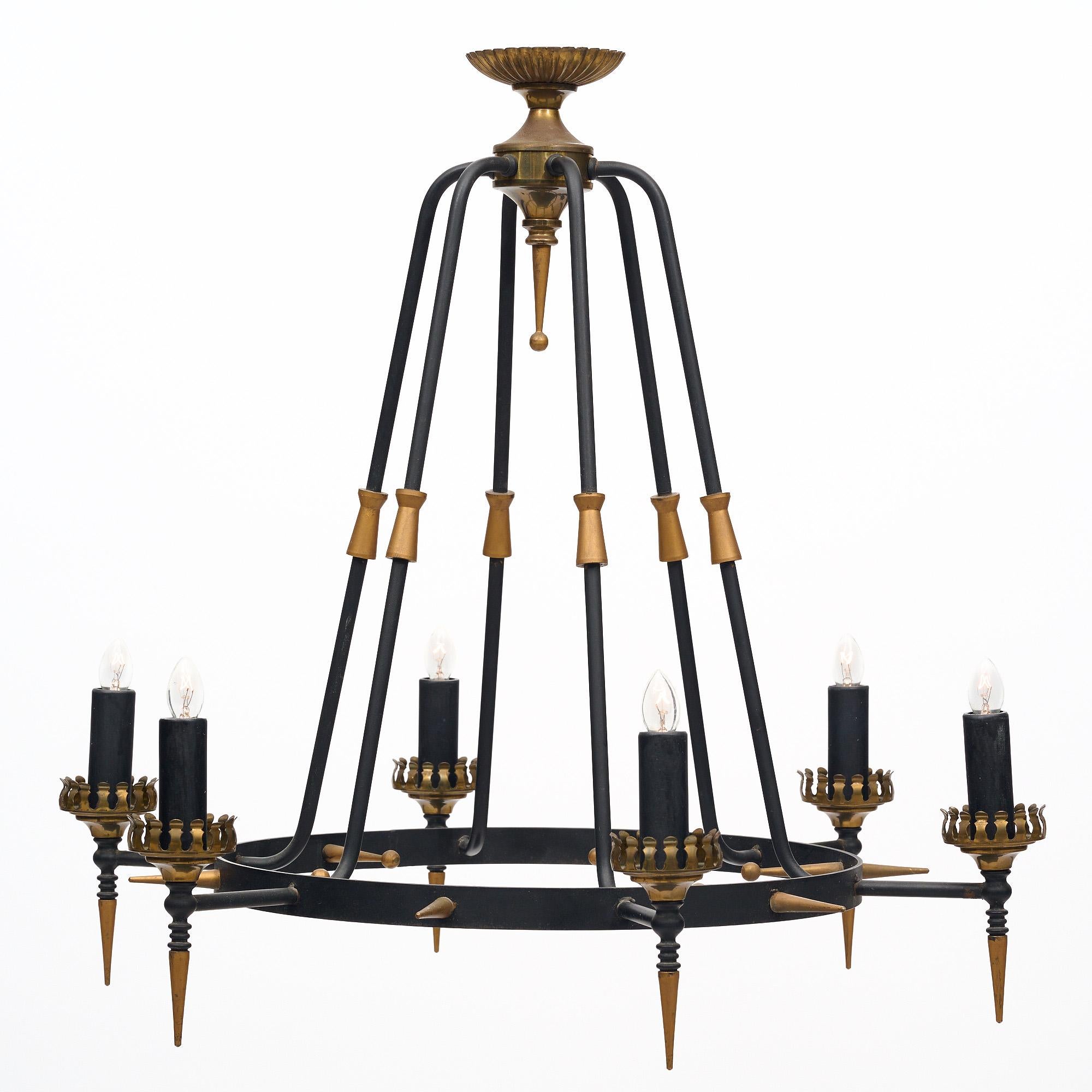 Chandelier from France in the neoclassical style. This piece is made of lacquered steel enhanced with gilt brass accents. It has been newly wired to fit US standards.
