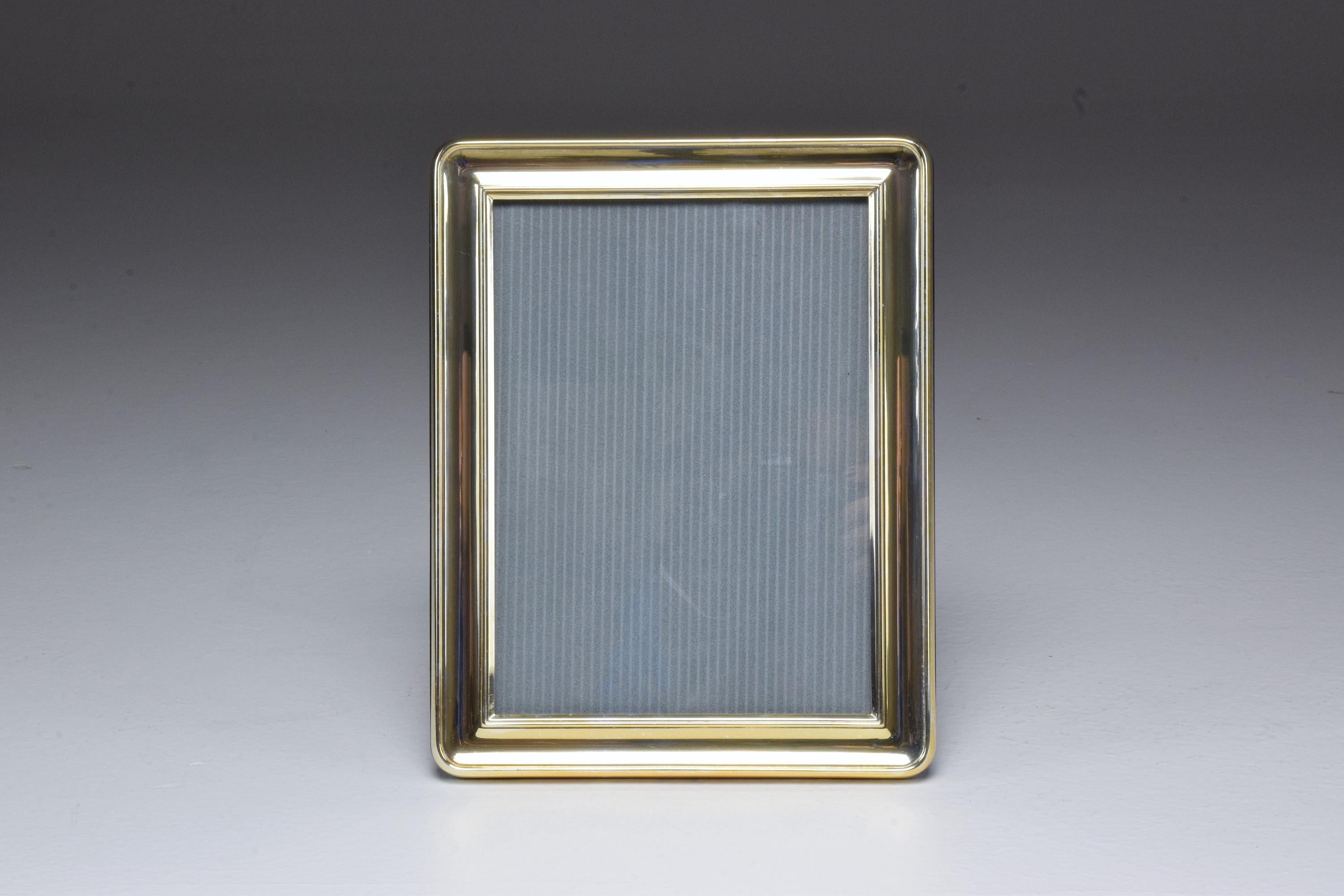 A 20th century vintage rectangular silvered brass picture frame with wood in reverse. Stamped and signed Christofle.
France, circa 1960s-1970s.
Art Deco style.