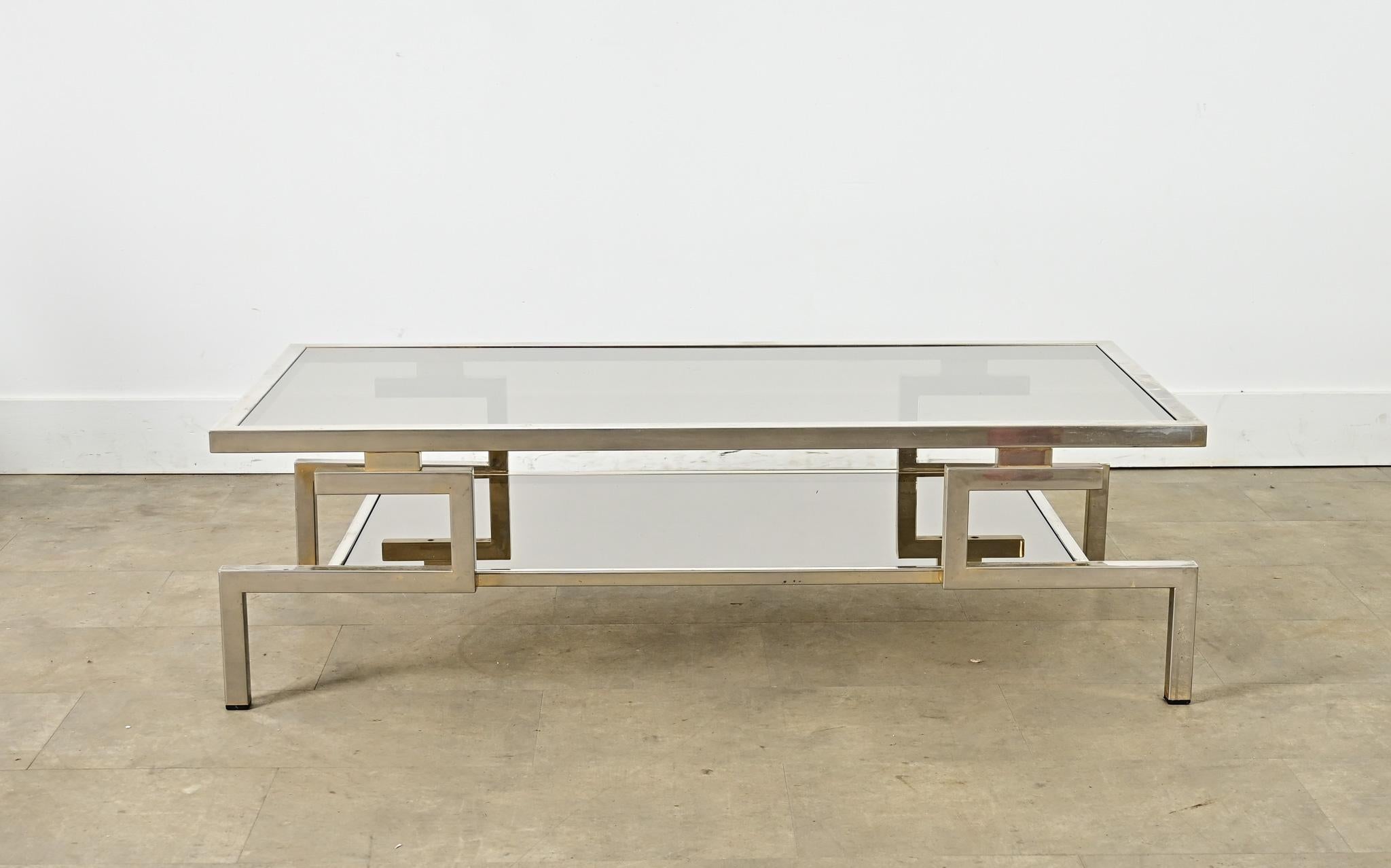 This sleek rectangular coffee table was produced by the legendary firm of Maison Jansen in the 1970s, part of a larger collected designed by Guy Lefèvre, reflecting a new gilded age of French design after the war built on the Moderne tradition with