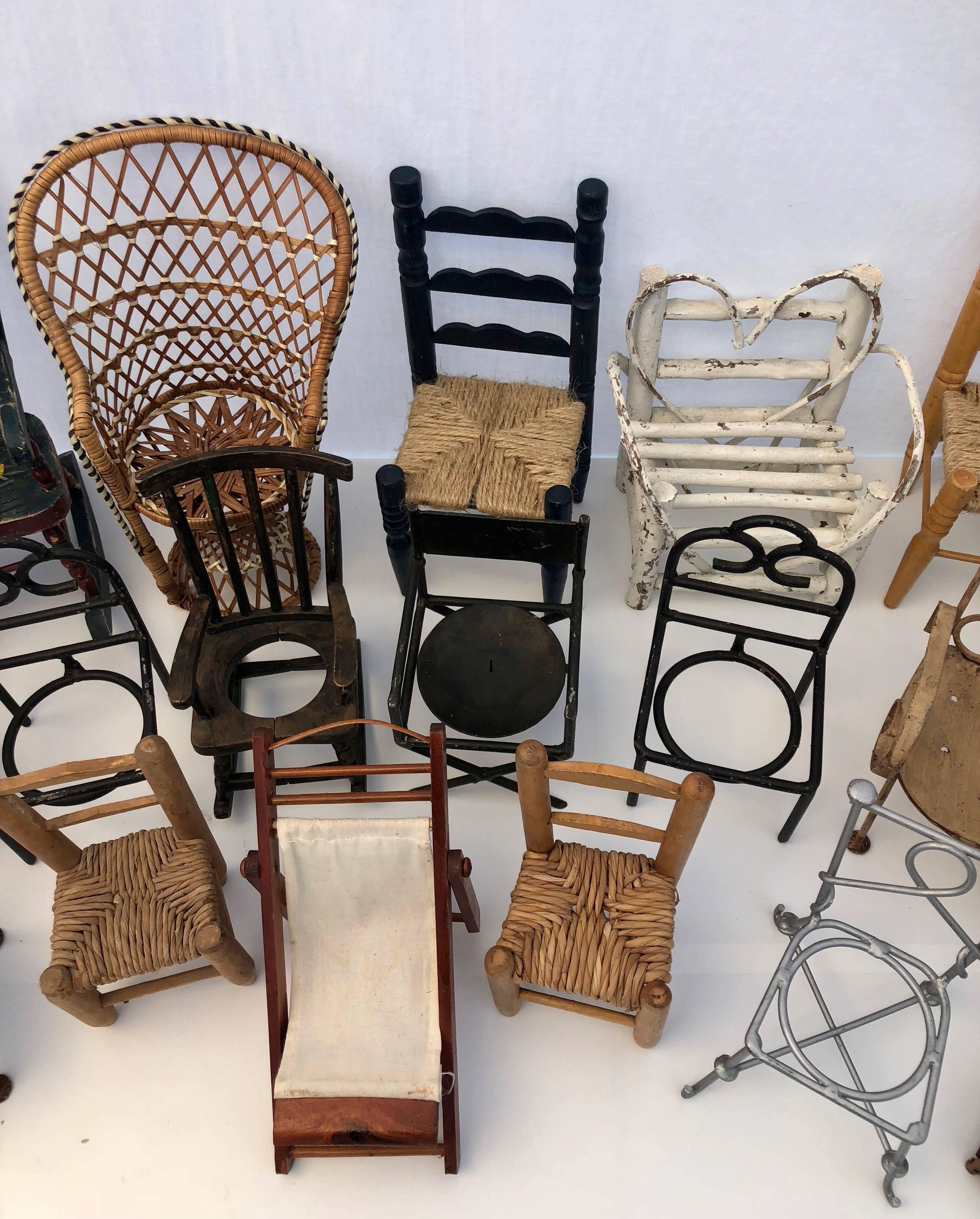 This French vintage collection of assorted miniature chairs are from a variety of periods in a variety of materials- from wood to wicker to iron and metal. Some were intended to hold small candles or plants while others were from doll houses or