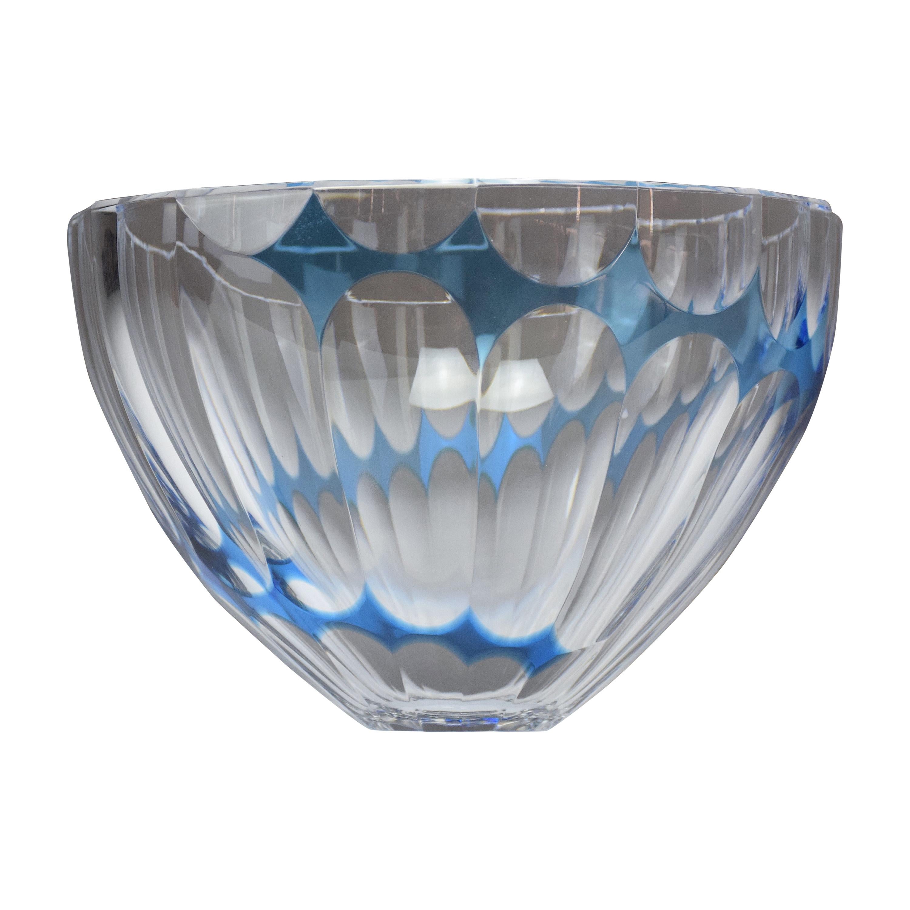 A 20th century vintage serving circular faceted crystal bowl or decorative centerpiece by iconic French Saint-Louis factory designed with light blue spiralizing geometrical shapes in a design typical of the 1960s-1970s period.
Labeled.
This