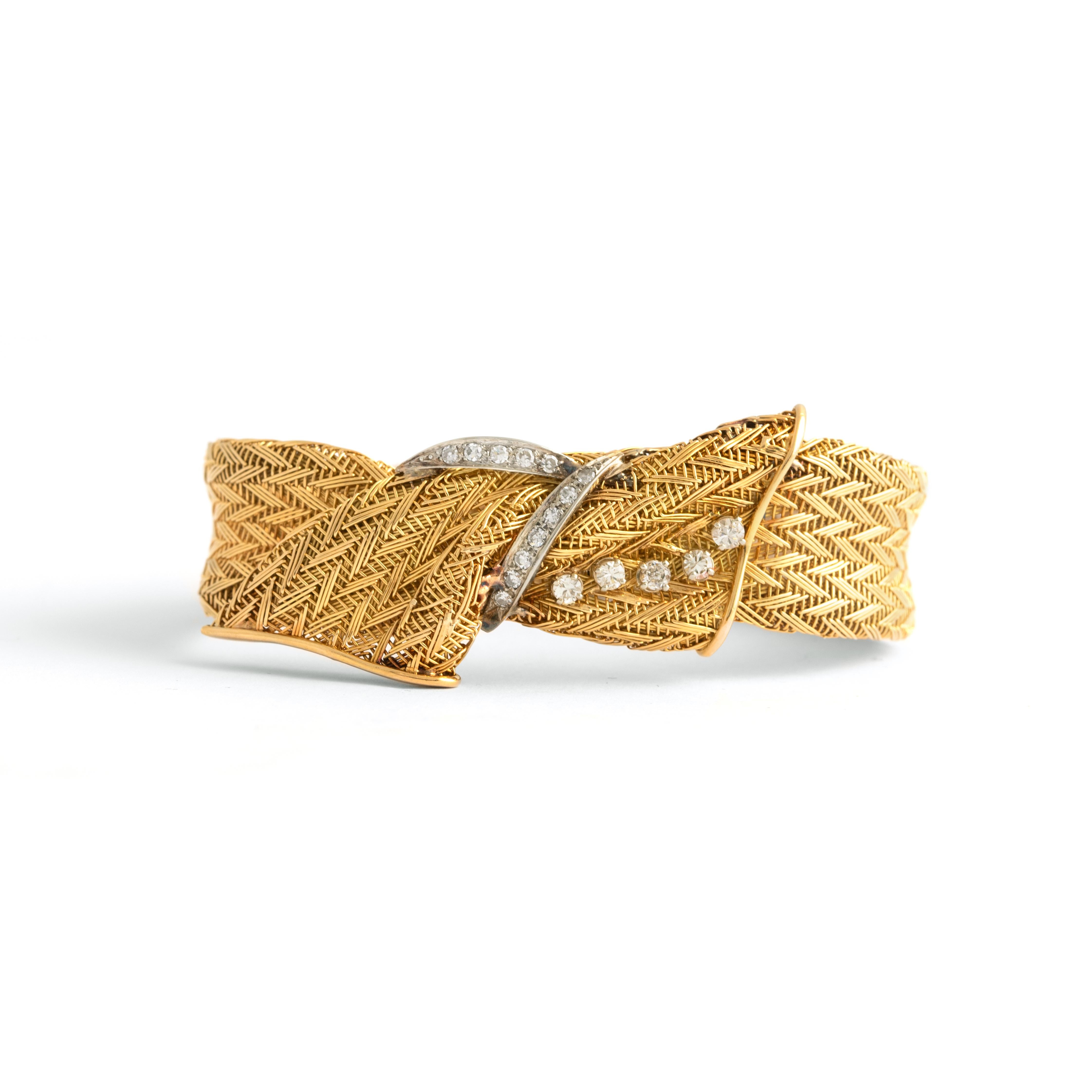 Vintage Diamond Yellow Gold 18K Bracelet. 
Circa 1960.
set with 5 diamonds and 12 diamonds.
Length: 19.00 centimeters.
Width: approx. 1.30 centimeters up to 2.40 centimeters.
French marks.
Total weight: 42.12 grams.
