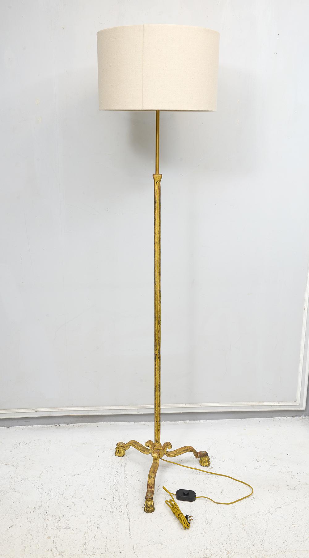 Gilt wrought iron floor lamp in the Ramsay Manner, shade included.