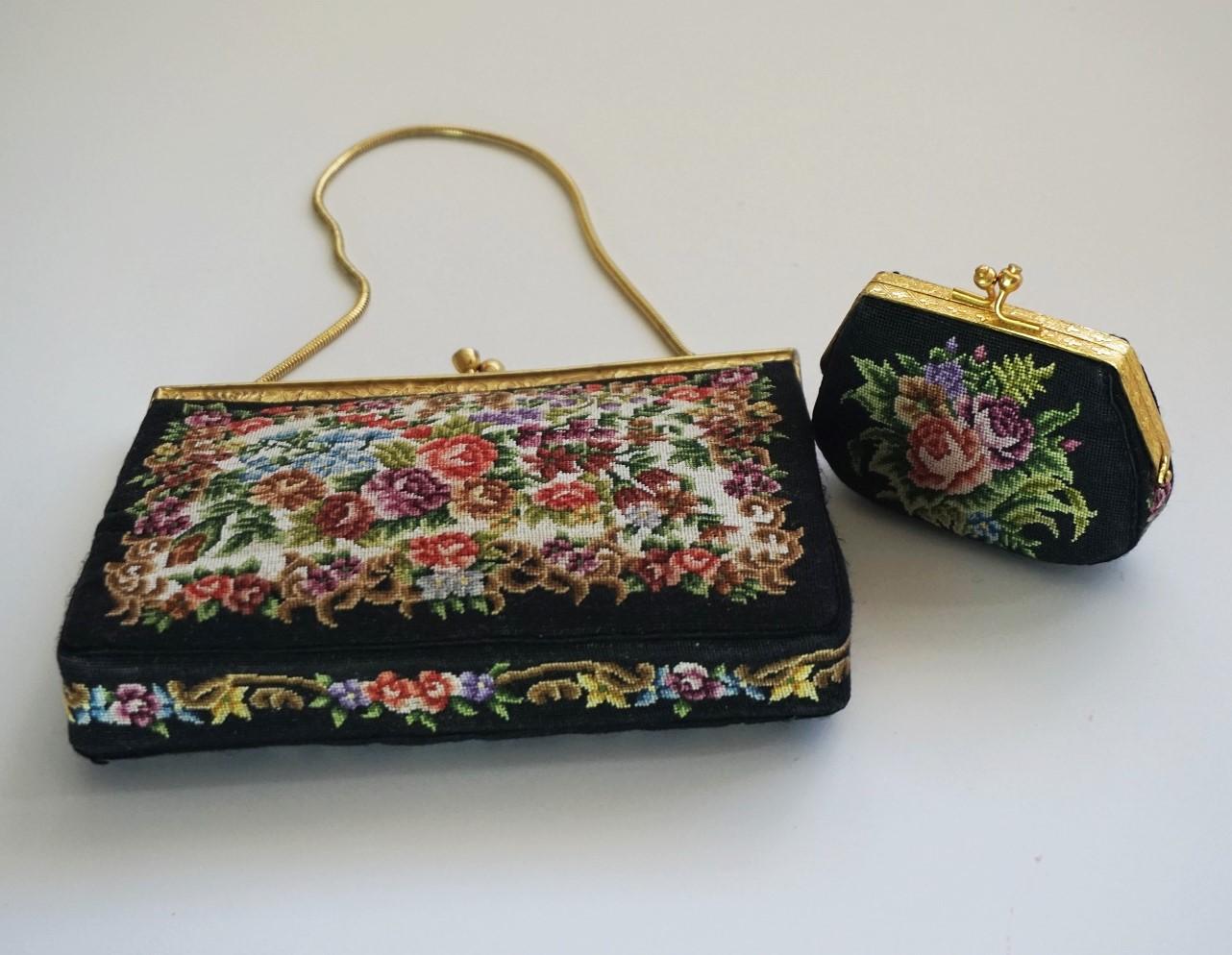 Vintage Gobelin set of clutch handbag and coin purse, black base with floral embroidery on both sides, enameled brass frame and chain strap. The interior is lined in black silk with a slip pocket, France, 1920s.
Measures:
Handbag width 7 in /