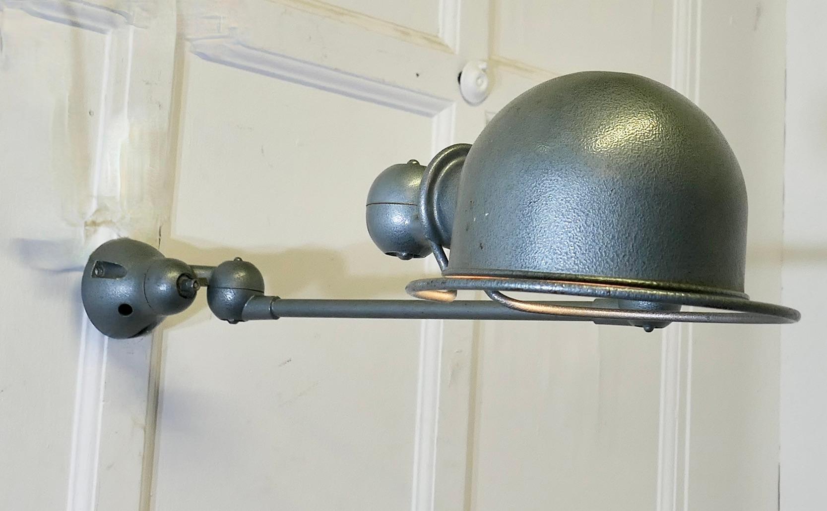 French Vintage Industrial Articulated Wall Light Sconce

This is a very unusual extendable factory light, it comes unrestored and it is working 
Fully extended the light is 46” long and the lamp shade is 8” in diameter
FB146