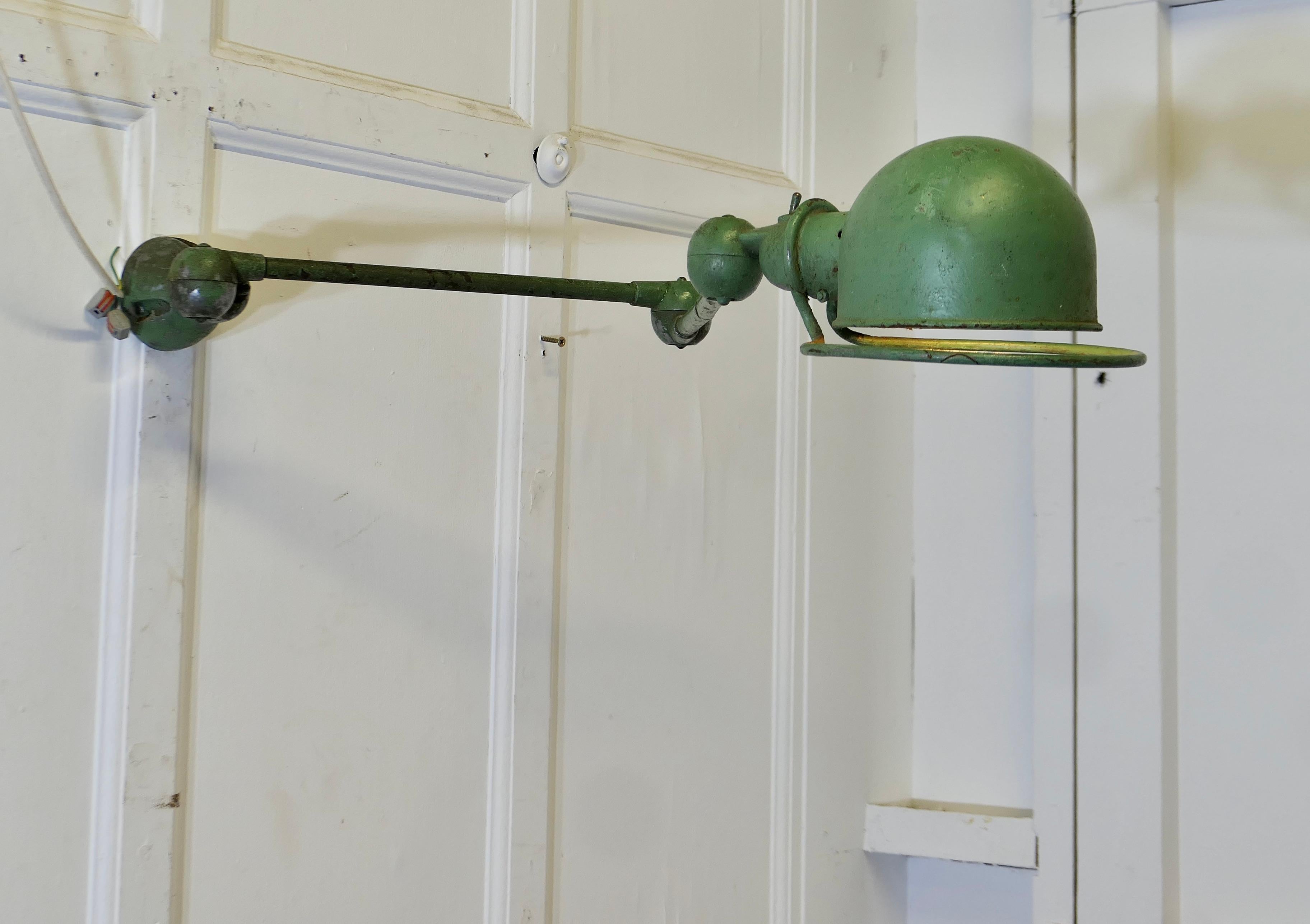 French Vintage Industrial Articulated Wall Light Sconce

This is a very unusual extendable factory light, it comes unrestored and it is working 
Fully extended the light is 47” long and the lamp shade is 8” in diameter
FB145