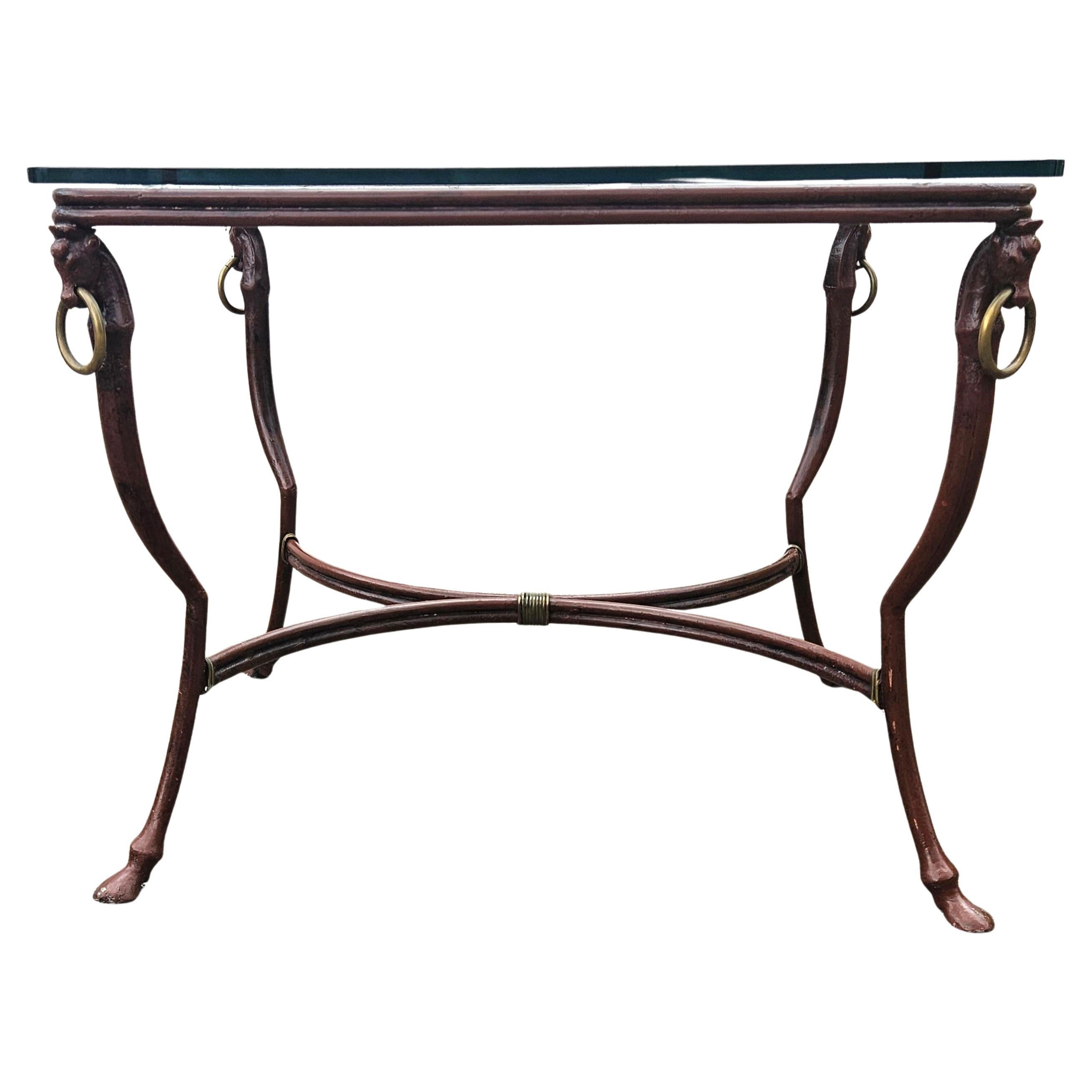 Unusual rectangular Coffee Table made of forged Iron and a massive Glass Top in Regency Style from the 80s.
The sturdy Table Frame is made of perfectly knotted and forgerd round Iron.
It has Inlays of woven Iron on the Top - the Table Legs are