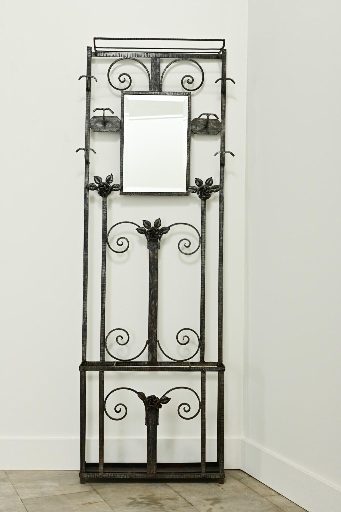 This vintage hall tree has whimsical features making for a stylish and functional coat rack. You’ll find a hat rack, six coat hooks, and storage space for umbrellas and canes. An inset beveled mirror in the center is perfect for adding finishing