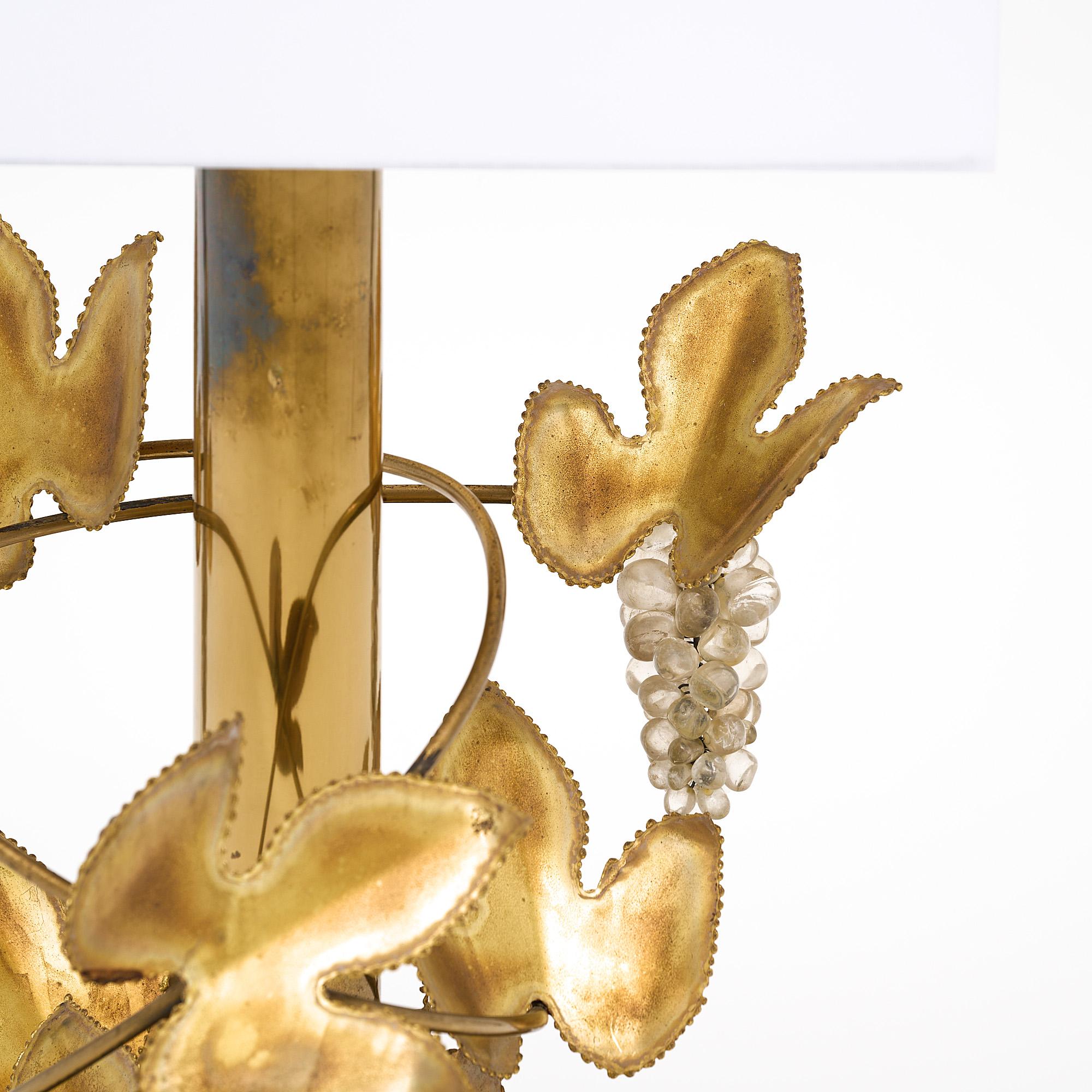 Table lamp, French, by Christian Techoueyres for Maison Jansen. The fixture features vine of embossed brass and glass grapes. It has been newly wired to fit US standards.