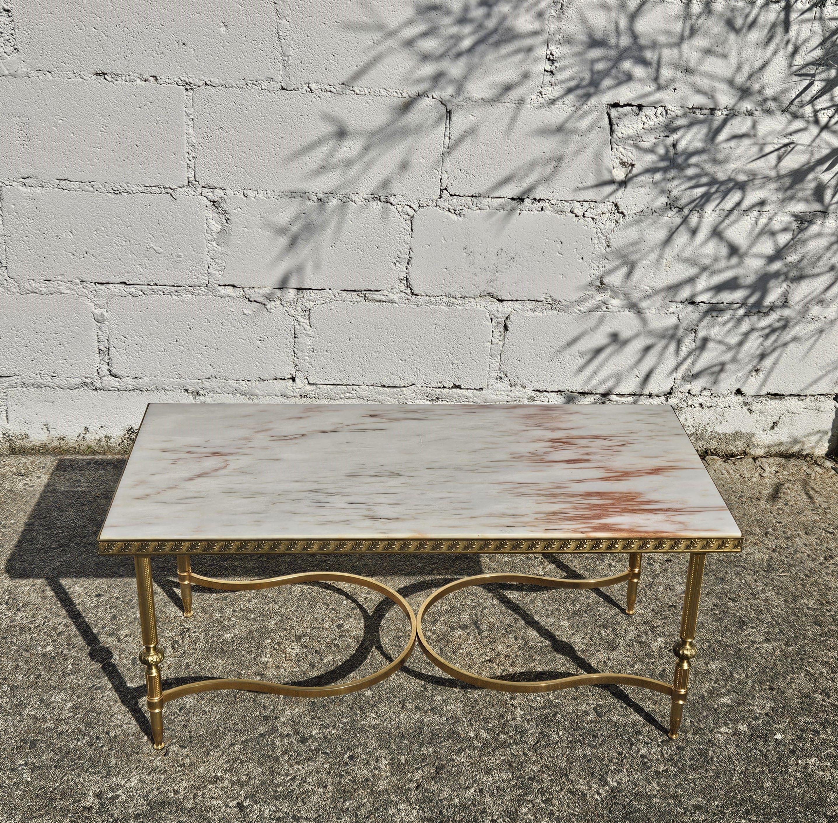 Vintage French Marble and Brass Cocktail Table Maison Jansen Style from the 70s
Elegant Coffee Table Style - the Marble Table Top comes with natural patterns in a beautiful mix of delicate clouds in white, rose, marron salmon red,grey, and grey.
The