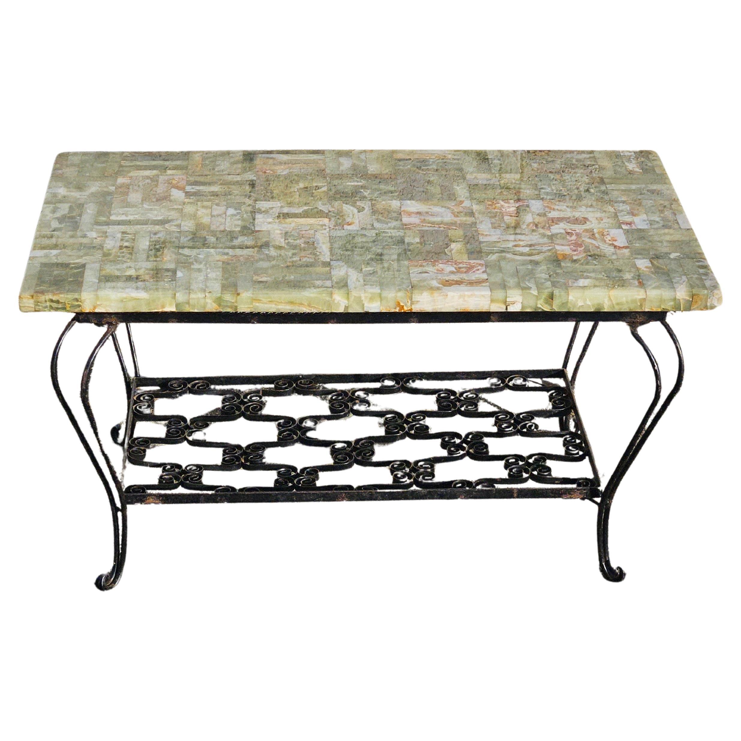 French vintage Onyx Marble Coffee Table - Cocktail Table- Lounge Table - Hollywood Regency Style from the 70s
The table top features a Mosaic Design in splendid Colours : jade ,green, mother of pearl, orange-brown
Elaborately forged Table frame with