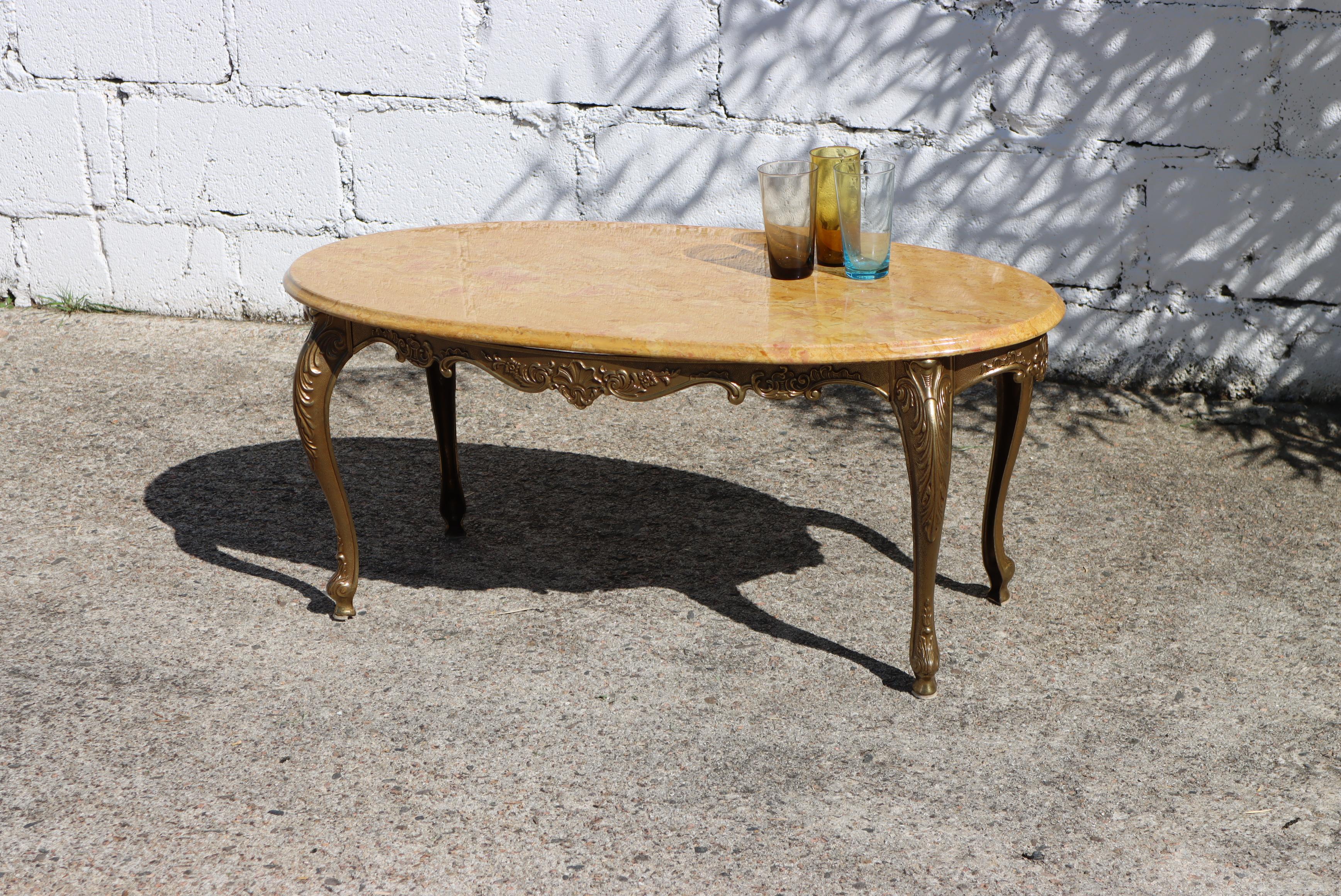 Wonderful French Vintage Travertine and Brass Coffee Table - Lounge Table Style Louis XV from the 70s

Oval Travertine Top all-round decorative Edge

Splendid Colors : beige, rose, brown, ochre- colors with natural Pattern

Stable and elegant