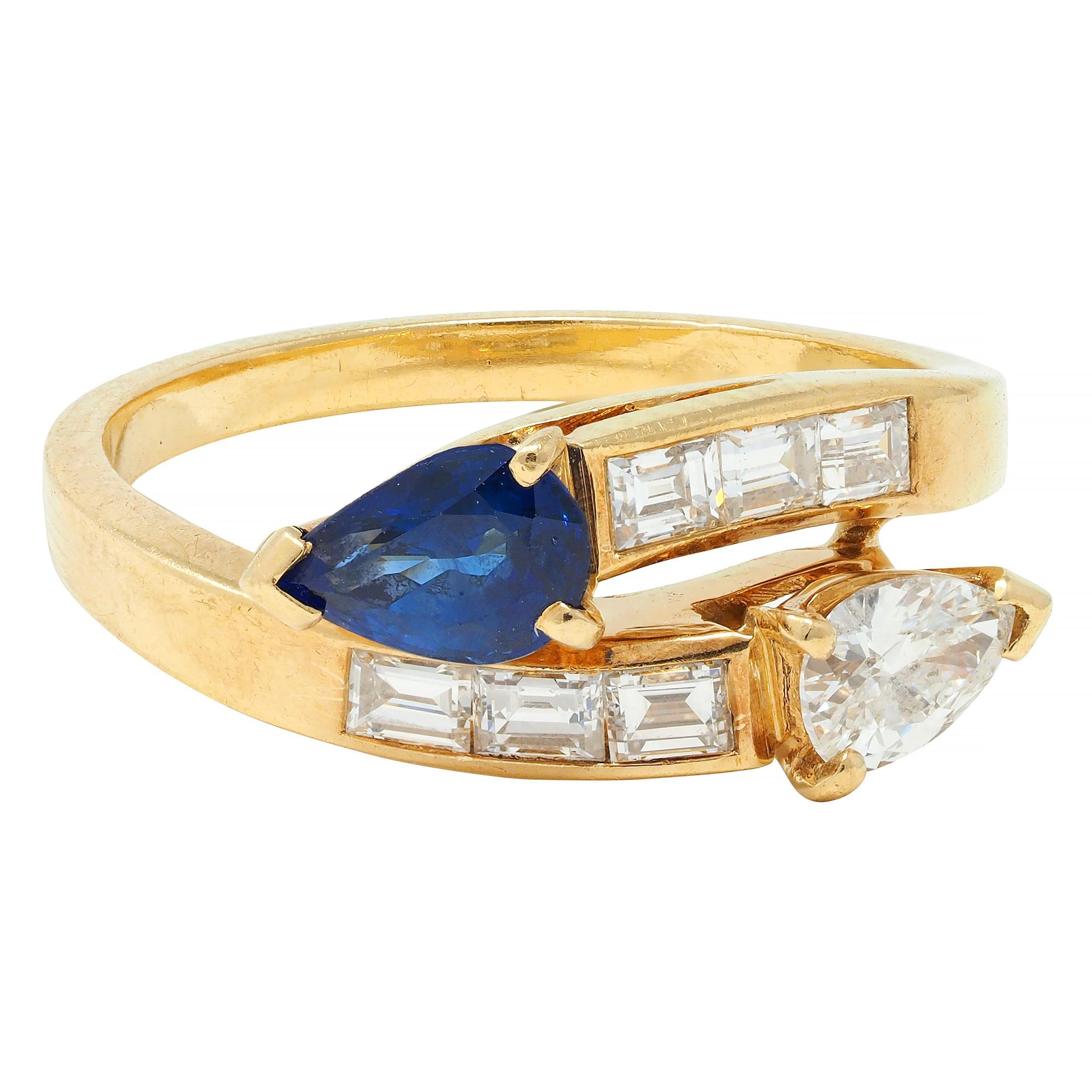 Ring is designed as a curving bypass with a prong set pear cut diamond on one end
Weighing approximately 0.26 carat total - H color with SI1 clarity
The other end terminates with a prong set pear cut sapphire
Weighing approximately 0.78 carat total