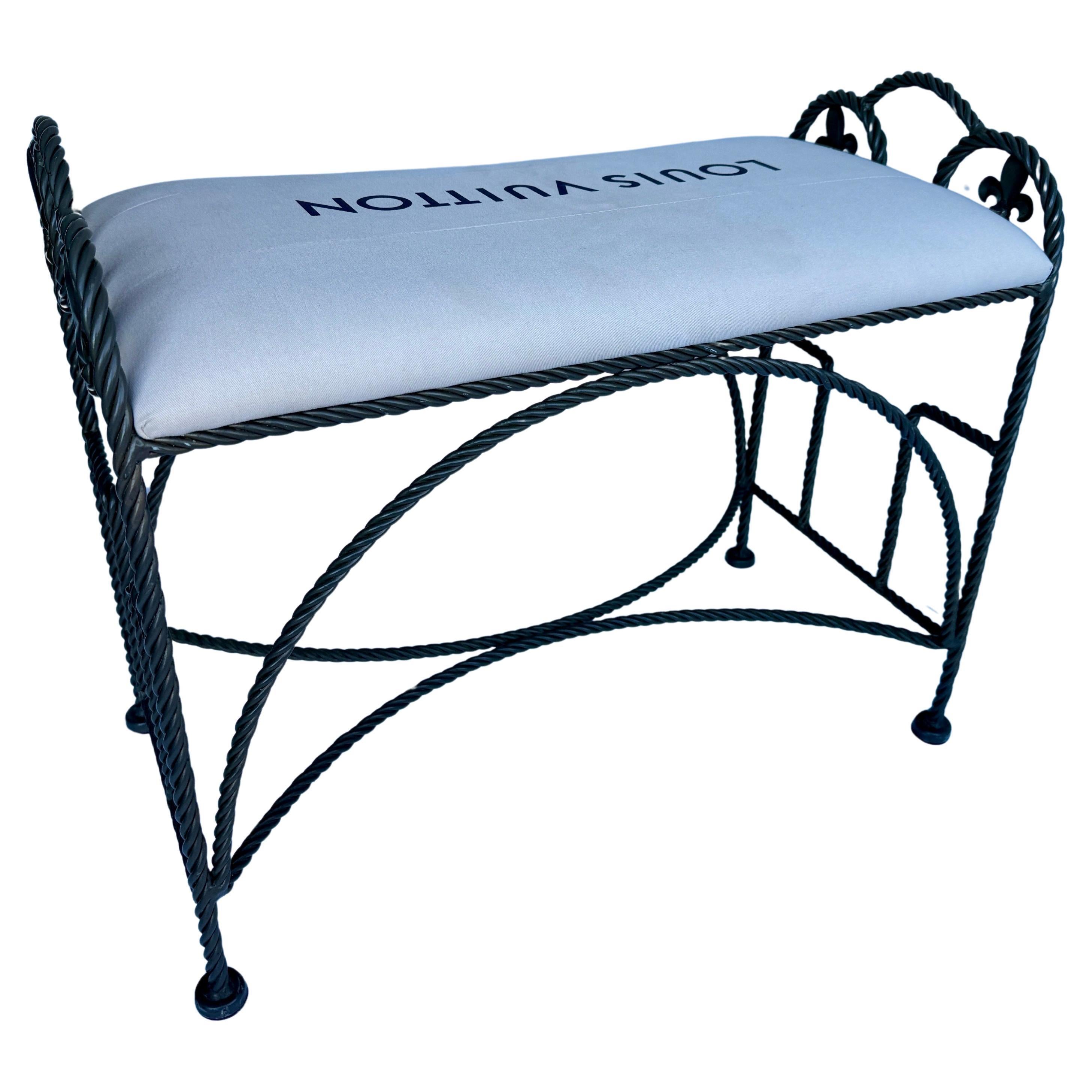 Vintage Roped Iron Bench With Louis Vuitton Bag Fabric, France

Design and purpose best describe this one-of-a-kind custom bench. This piece features authentic Louis Vuitton material atop a very sturdy rope bench, with fleur de lis detailing, in a