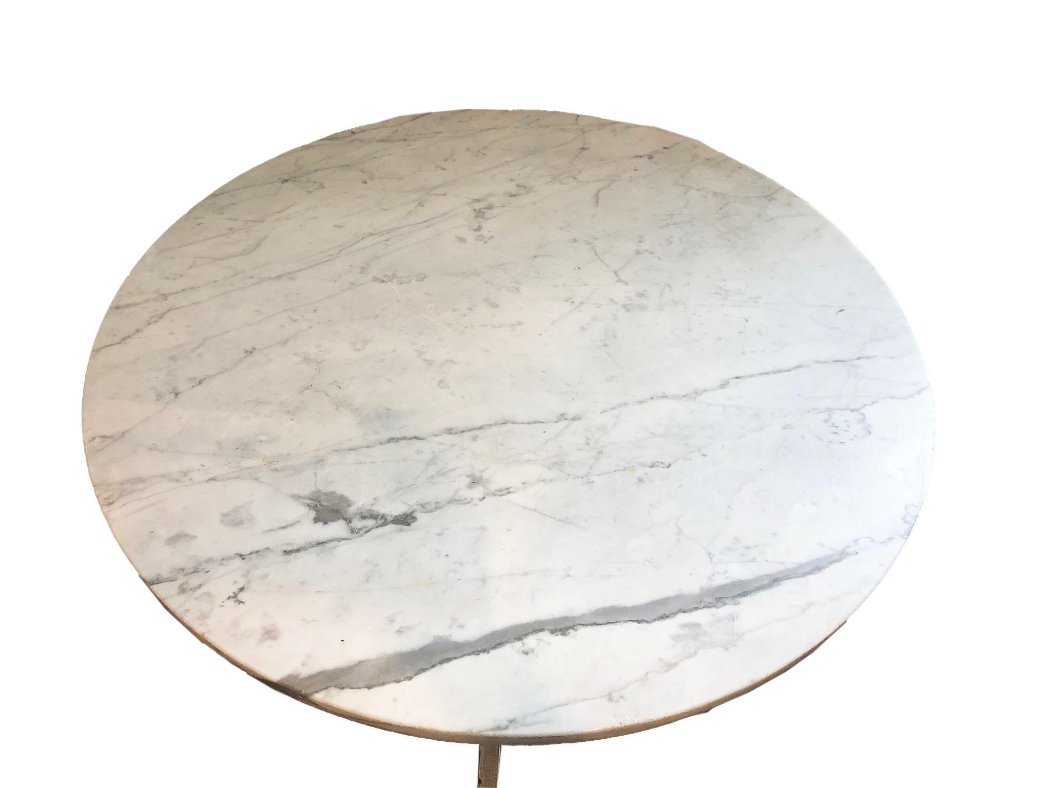 This charming table is versatile and can be used as a dining table, side table, entry table a much more! The legs are painted in original paint and the top is grey and white marble.

   