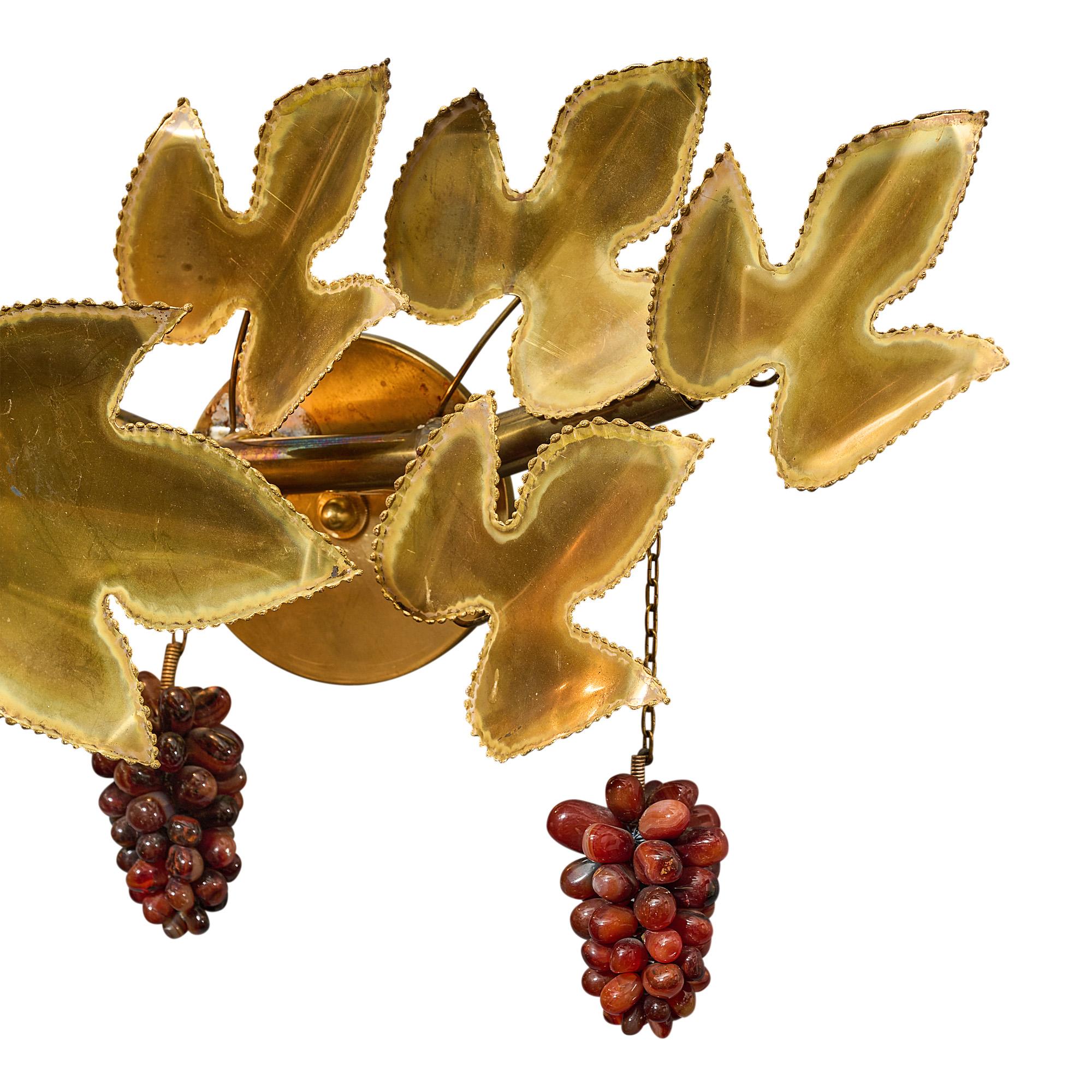 Sconce, French, by Christian Techoueyres for Maison Jansen. The fixture features vine of embossed brass and glass grapes. It has been newly wired to fit US standards.