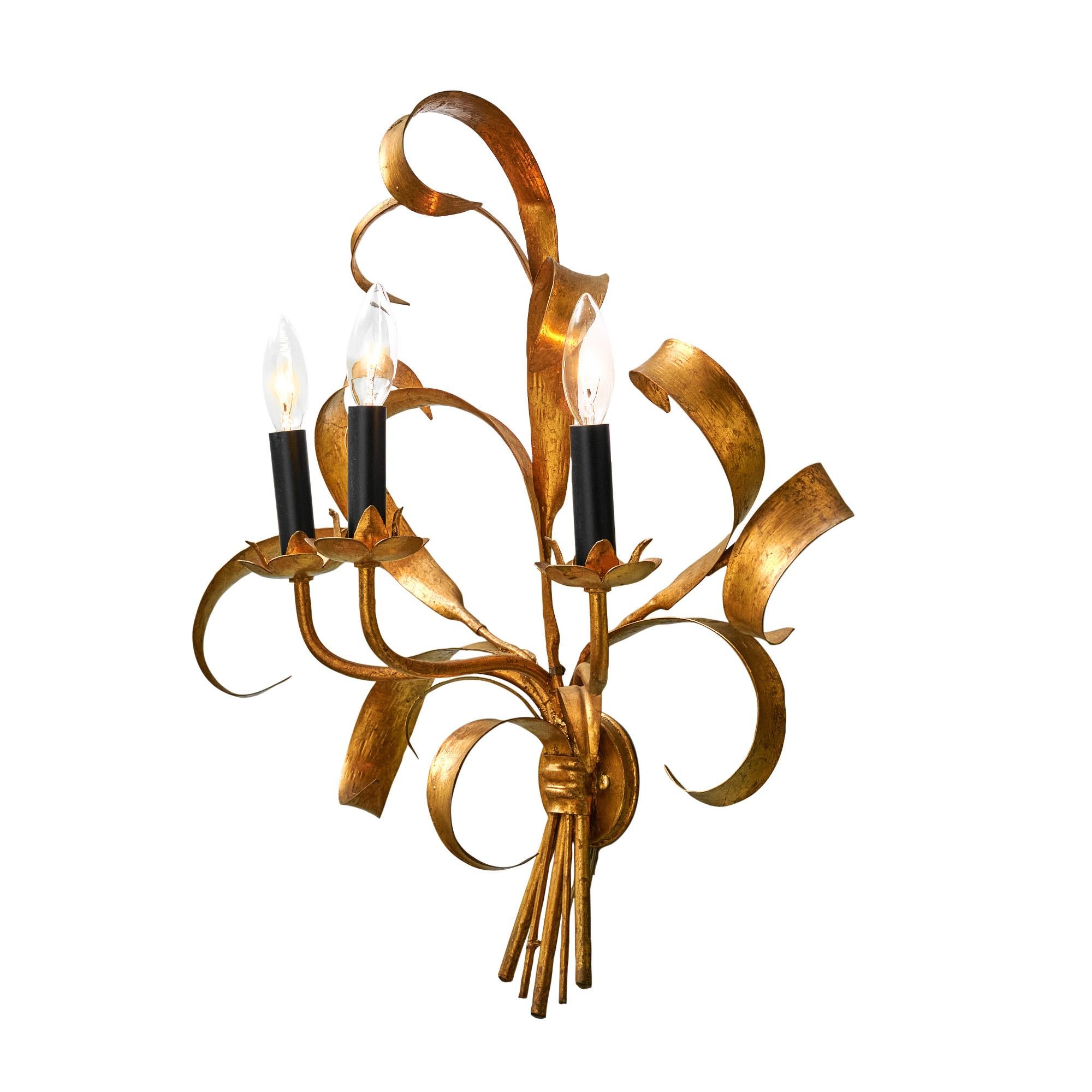 Single sconce from France made of “tole” metal and finished with gold leaf. This light has been newly wired for US standards and is in very nice vintage condition with only minor surface wear consistent with age and use. The photos accurately depict