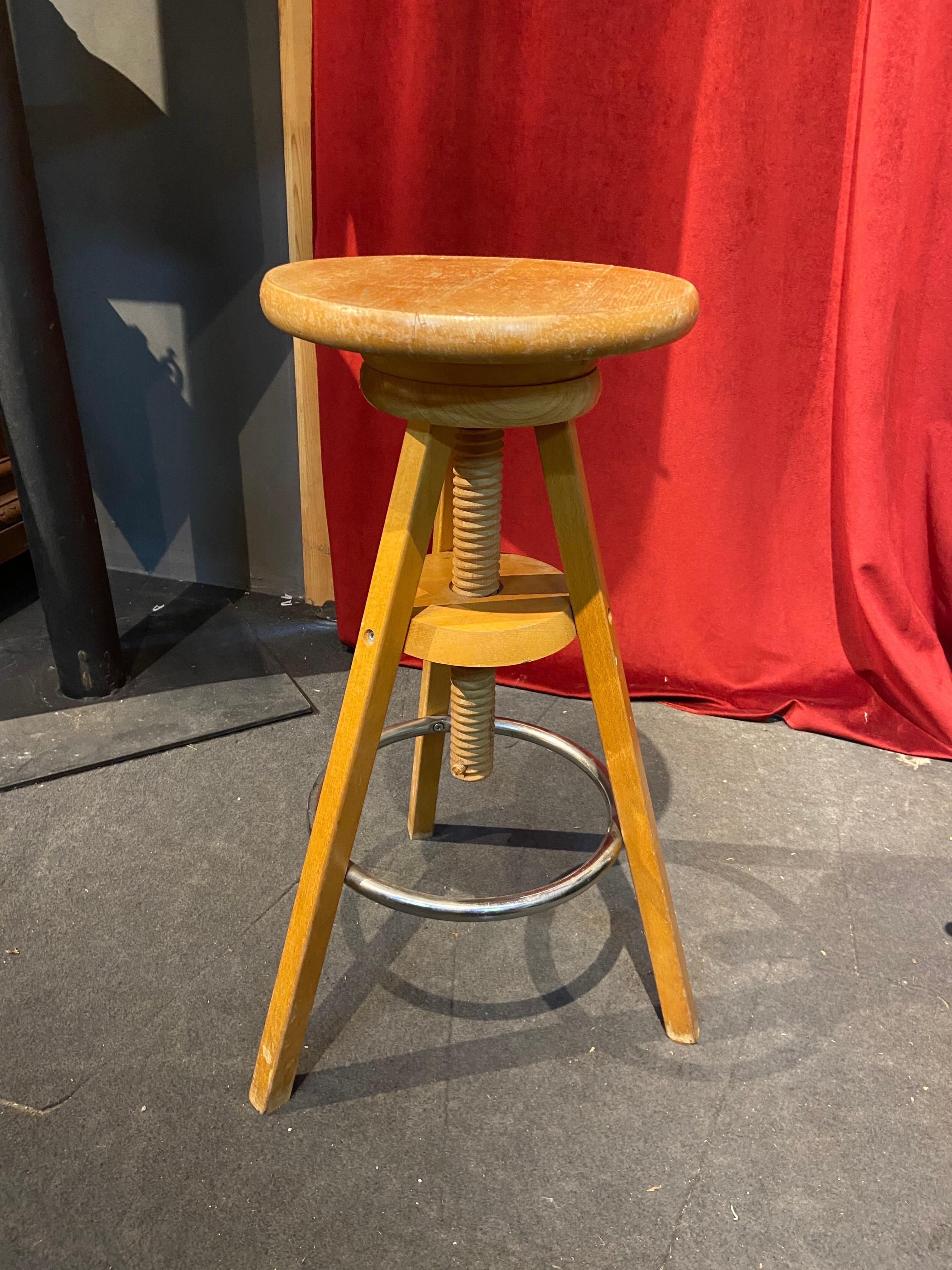 Wooden swivel round chair usually used in artists studios. Made in France in mid 20th century it is still very stable and comfortable to work on it. There are no restorations and it is in original condition.