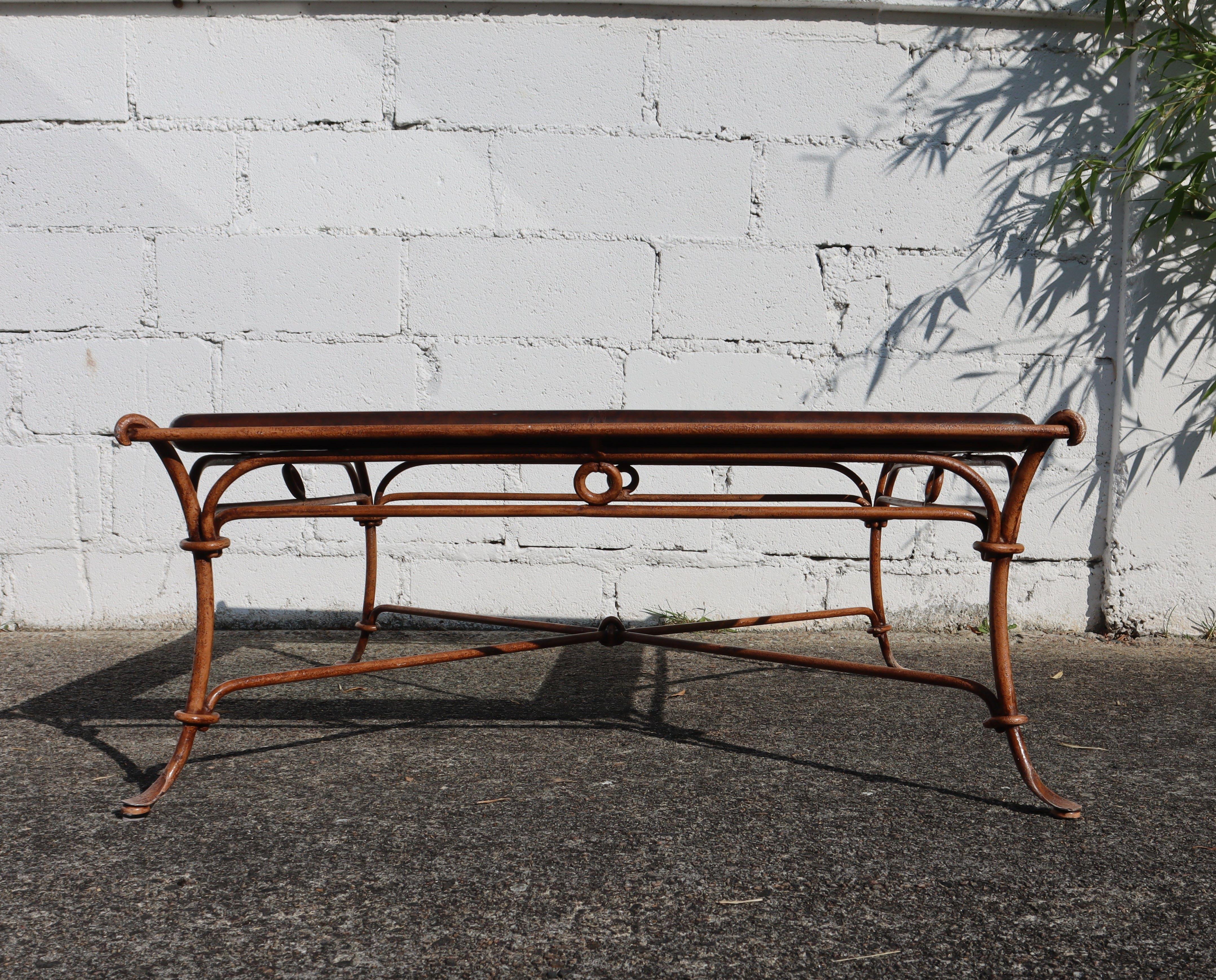 Autumn Sale: Enjoy FREE IN-HOME delivery to France and special Shipping Offers for many other Countries.

Unusual big Square Coffee Table made of forged round Iron with embossed Leather Border and an Inlaid Glass Top in the Center in Regency