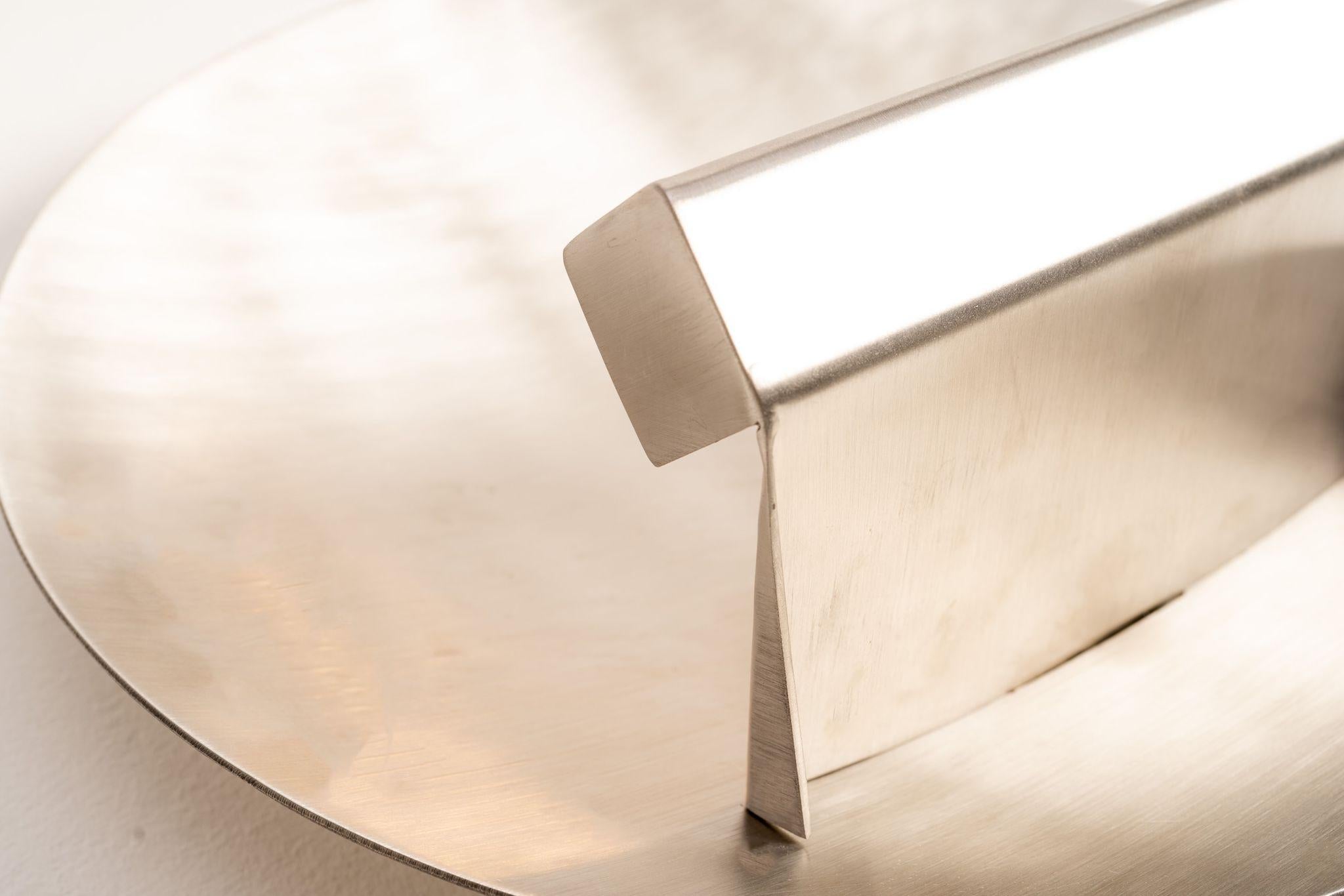 This stunning Vintage stainless steel wall light is a rare find, perfect for adding a touch of French elegance and luxury to any home. 
Made of durable stainless steel, this timeless piece is sure to last for generations, due to their unparalleled