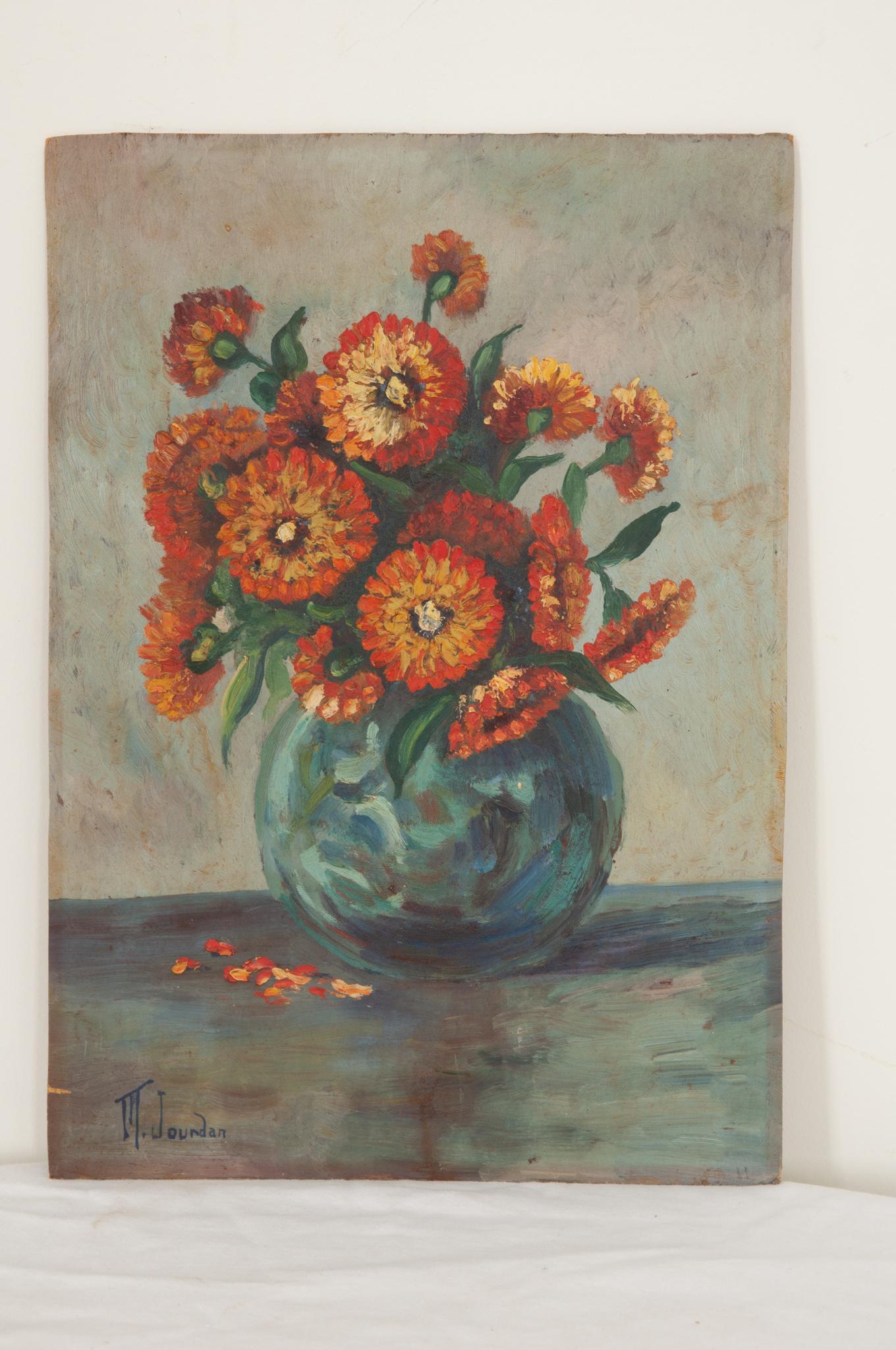 A lovely French still life painting of vibrant zinnias from France painted on board. Signed by the artist in the bottom left hand corner by M. Jourdan. Some wear around the edges gives it a great patina. Make sure to view the detailed images to get