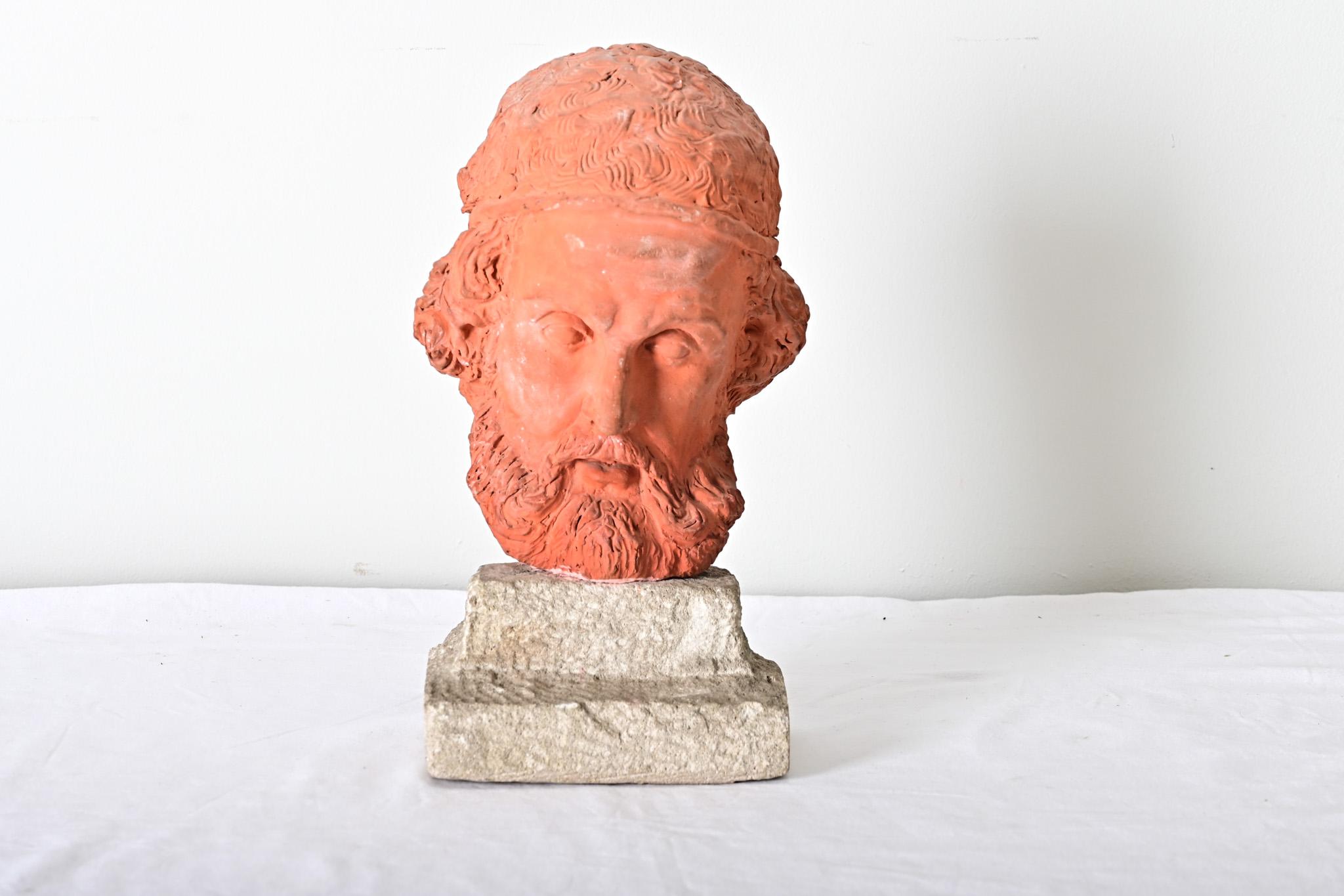 A unique, vintage 20th century French reinterpretation of Classical Greek sculpture portraying the “Father of History” Herodotus (5th century BCE) in hand-sculpted terracotta on a carved, stone base. From a technical perspective the artist has used