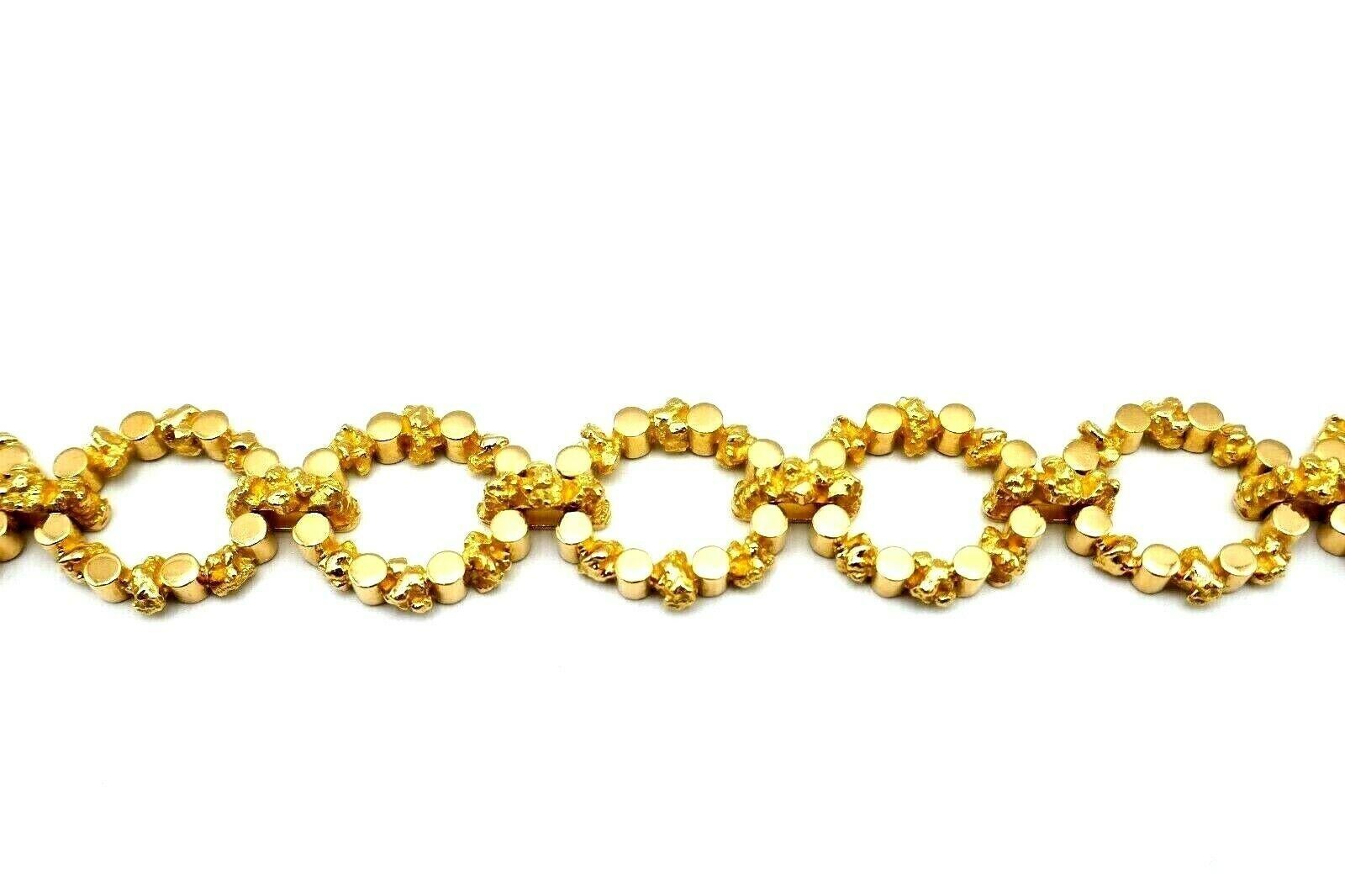 A unique vintage French bracelet. Made of 18k yellow gold. Has a great combo of hammered and polished gold. Stamped with a French marks and a hallmark for 18k gold. 
Measurements: 7 3/4