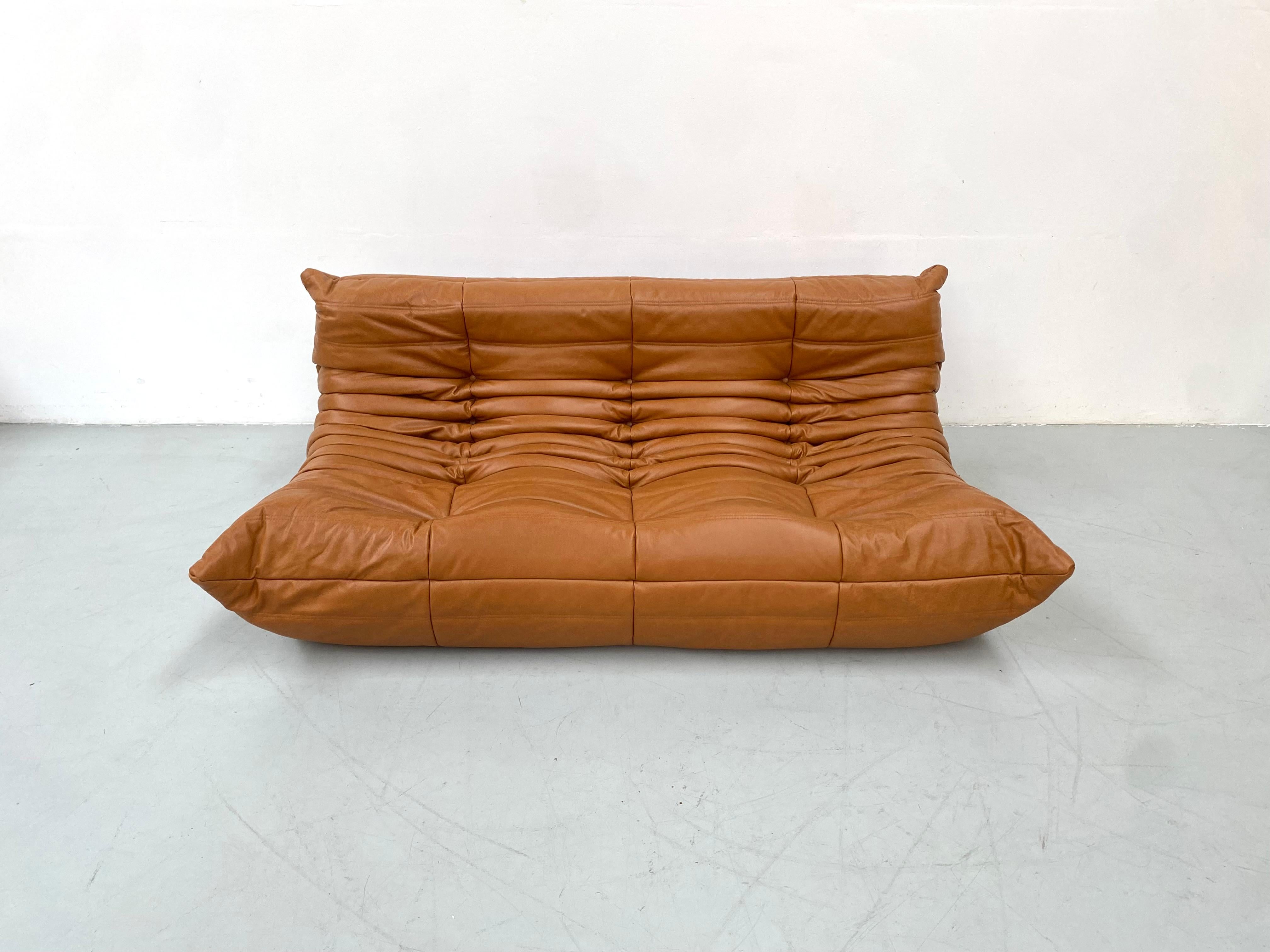 The Togo was designed by Michel Ducaroy in 1973.  It is the first sofa/chair ever made only of foam and leather. The innerwork consists of foam in 5 different densities. Manufactured by Ligne Roset in France.