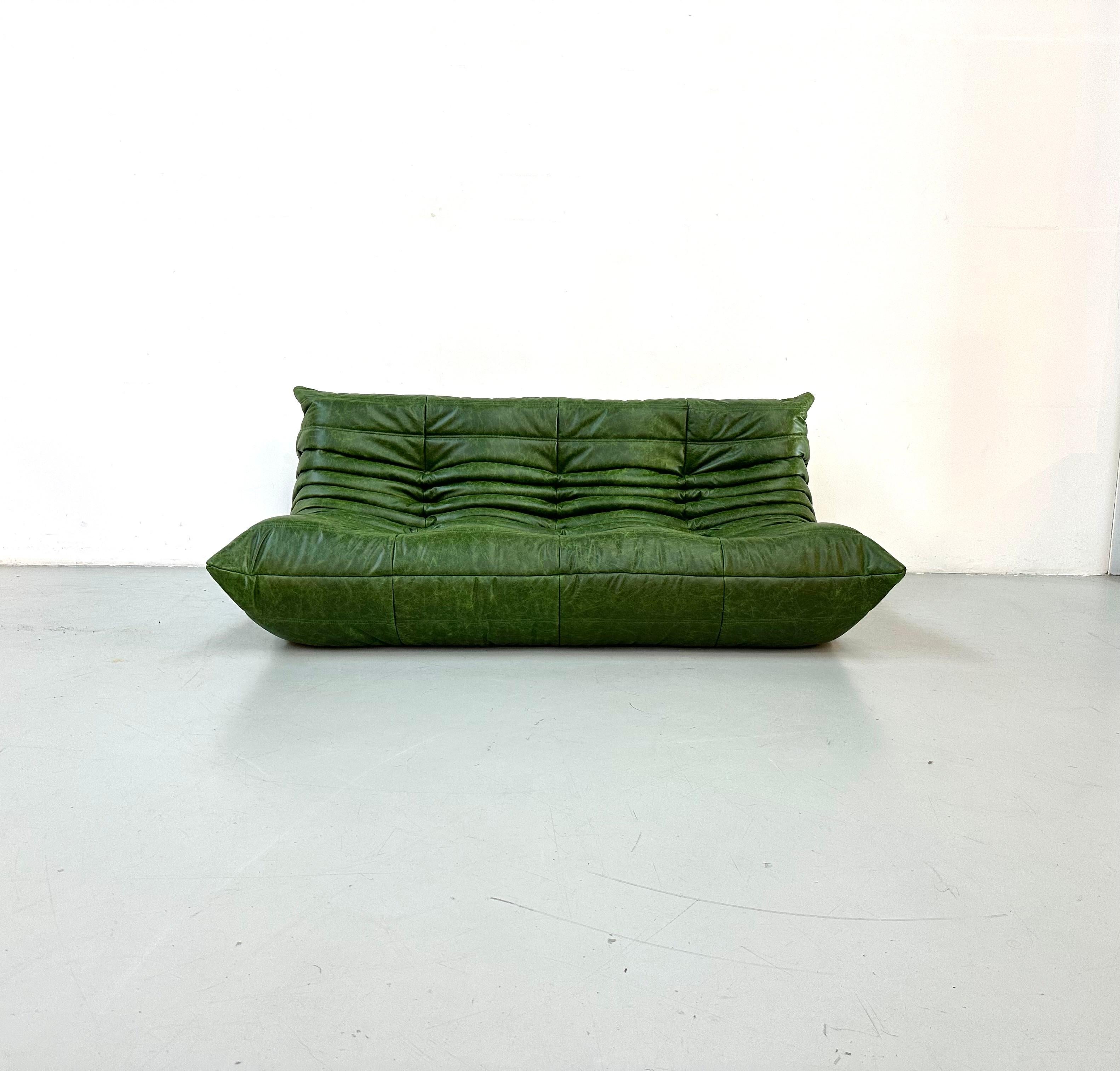 The Togo was designed by Michel Ducaroy in 1973 for Ligne Roset. It is the first sofa/chair ever made only of foam, so totally frameless. The innerwork consists of foam in 5 different densities. Thereafter the sofa is reupholstered.
