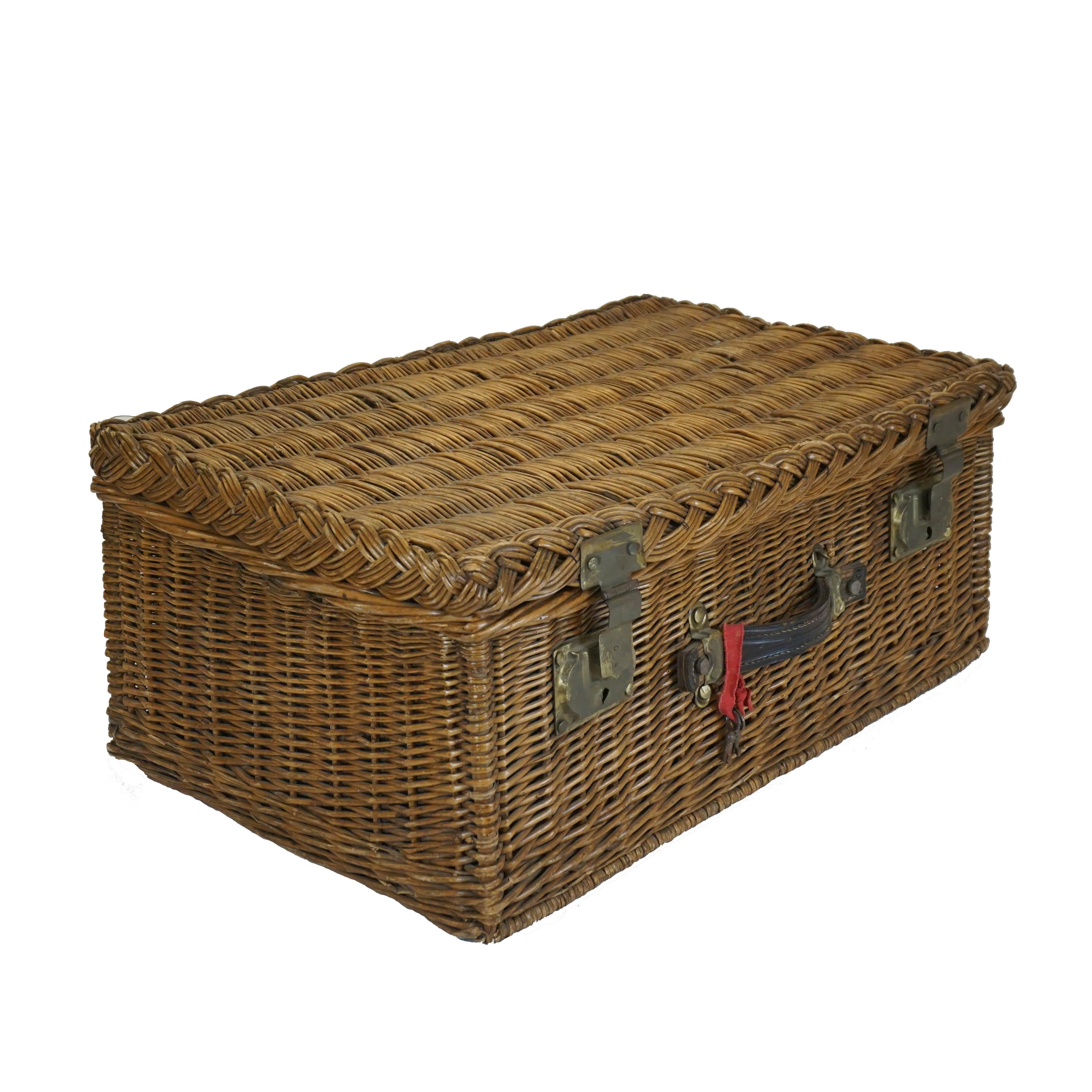 Vintage traditional woven wicker case in a classic pattern, charmingly lined with blue and white gingham fabric. This basket was made by an unknown manufacturer in France, circa 1960s. Finely crafted with a chunky leather handle and metal hardware,