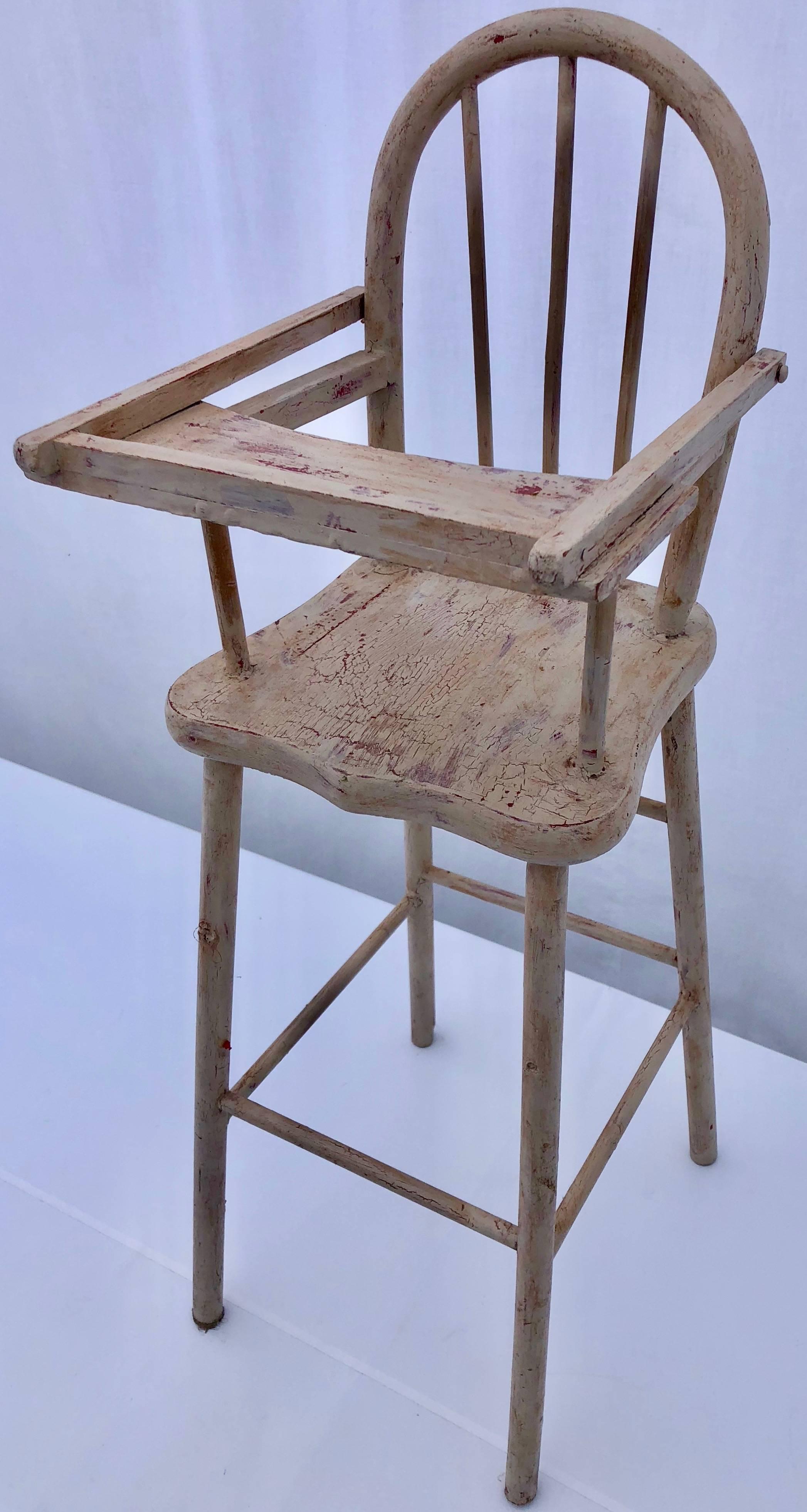 This French vintage doll high chair is solid wood, with it's back in a lovely rounded shape, and an articulated tray in a pretty pale pink color. When the tray is lifted it converts into a doll play seat. This would add a French touch to any doll