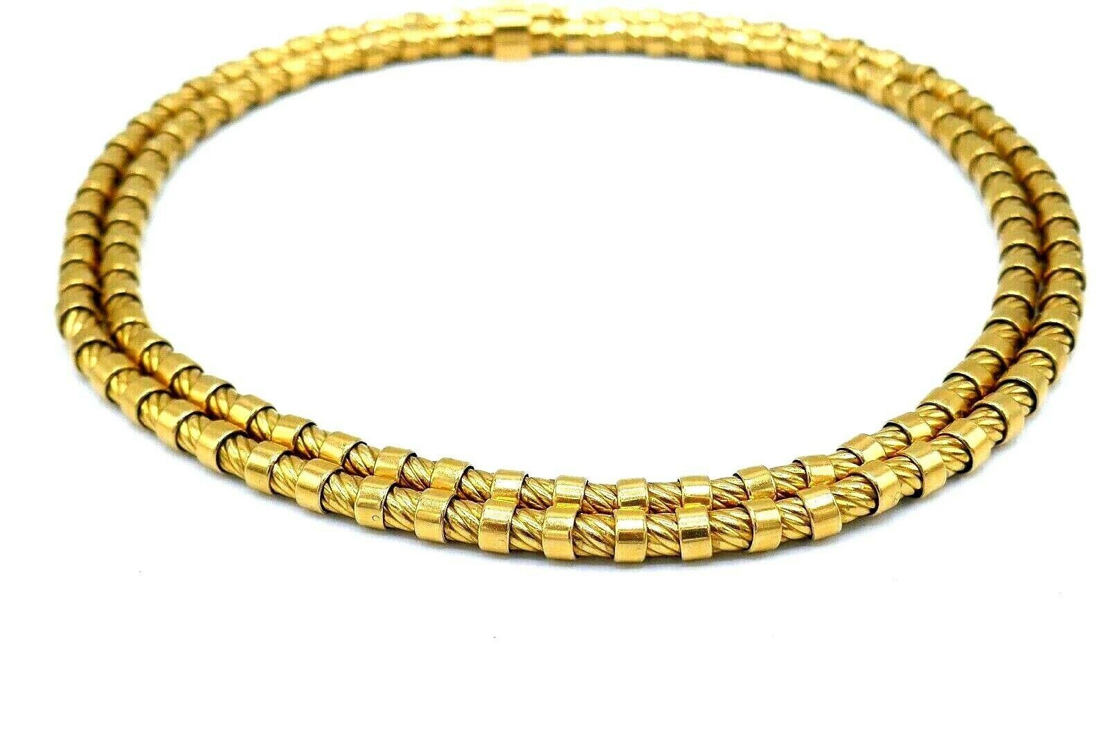 Chunky yet flexible rope chain necklace features two chains that are connected in the clasp area. Made of 18k yellow gold. Stamped with French and maker's marks.
Measurements: 16