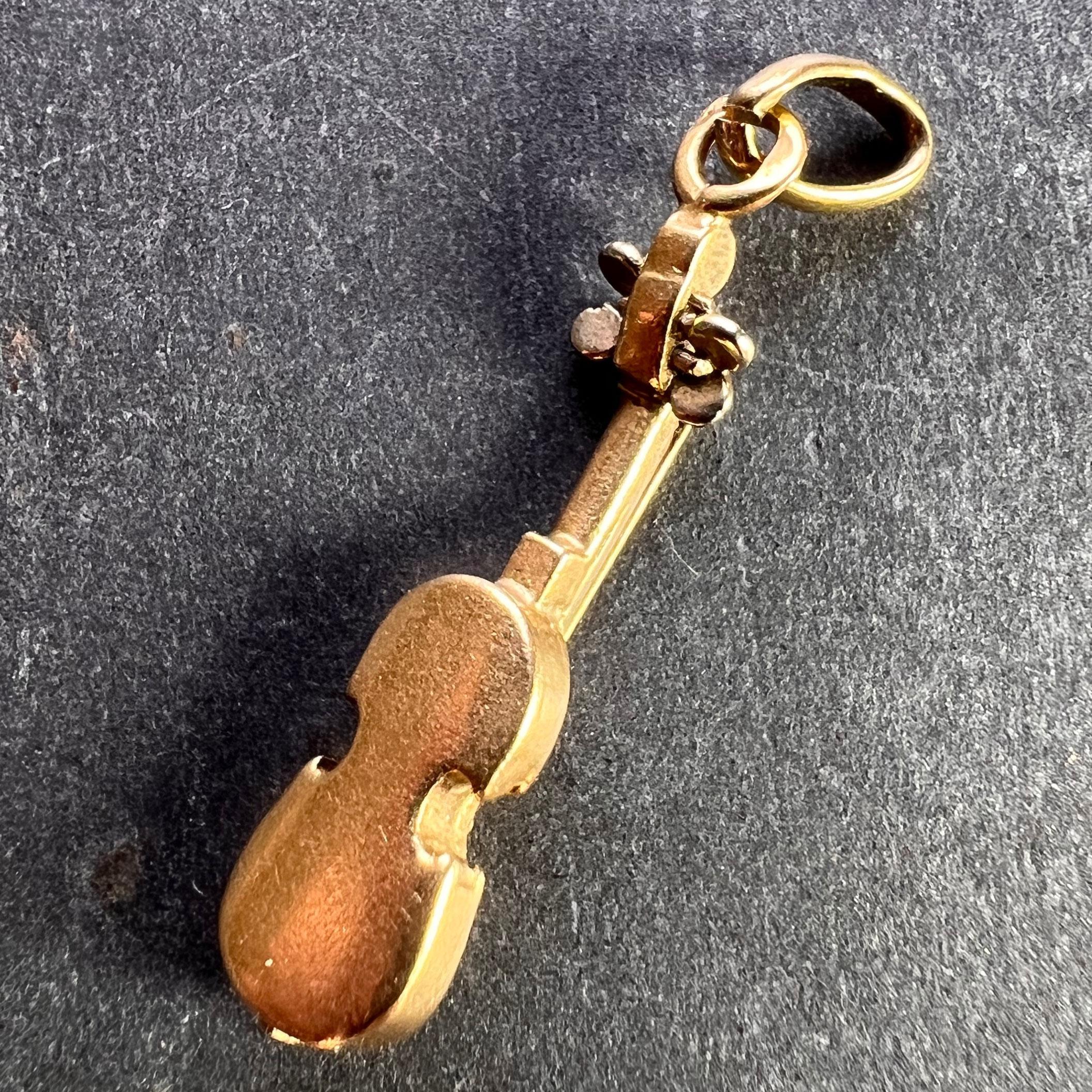 white and gold violin