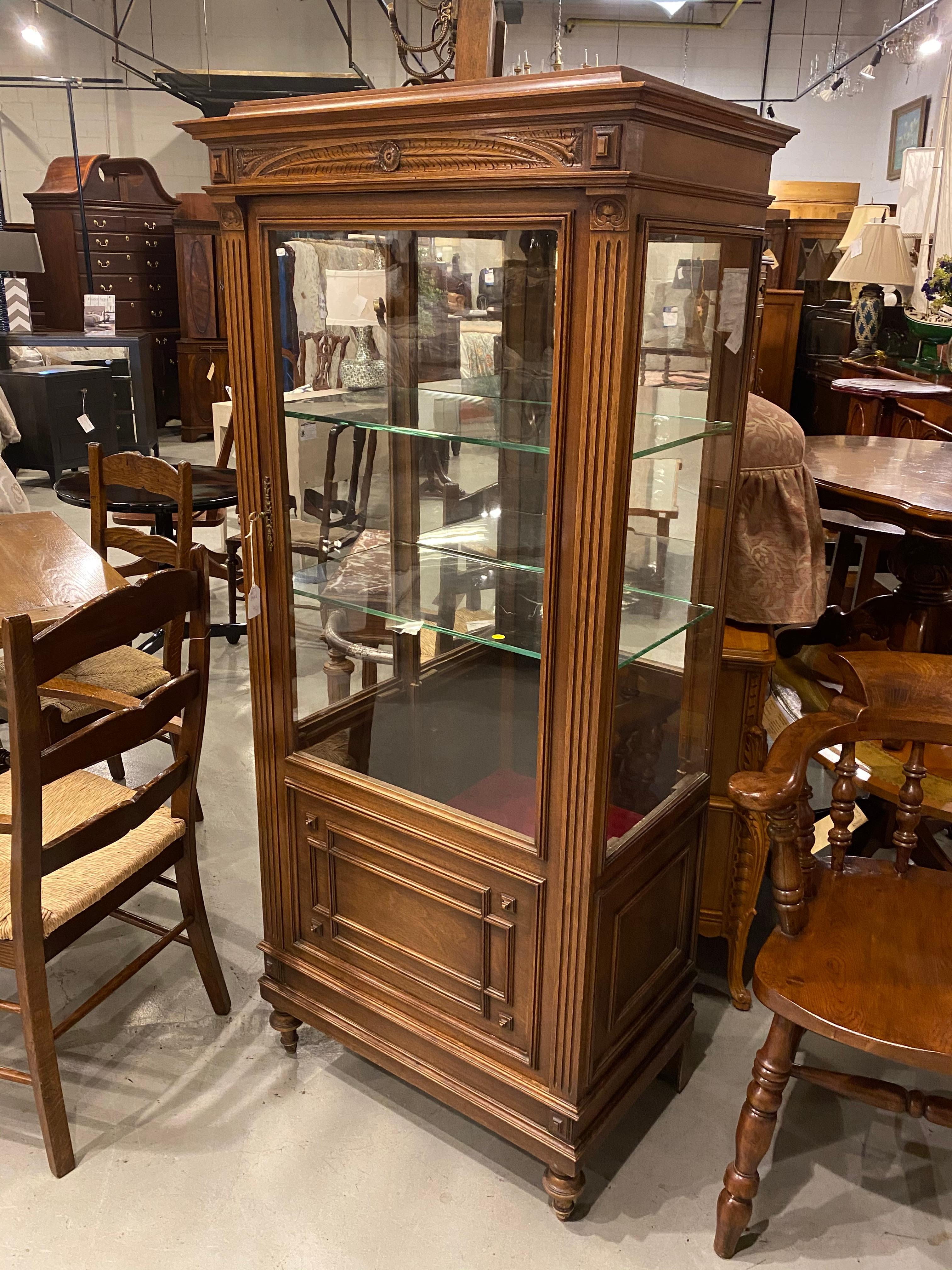 A French vitrine cabinet with glass door and sides, in walnut with rosewood and tulipwood, top 
with a grey marble top. 
The ormolu mounts give the cabinet the Louis XV styling that is elegant and formal. An excellent home to display a cherished