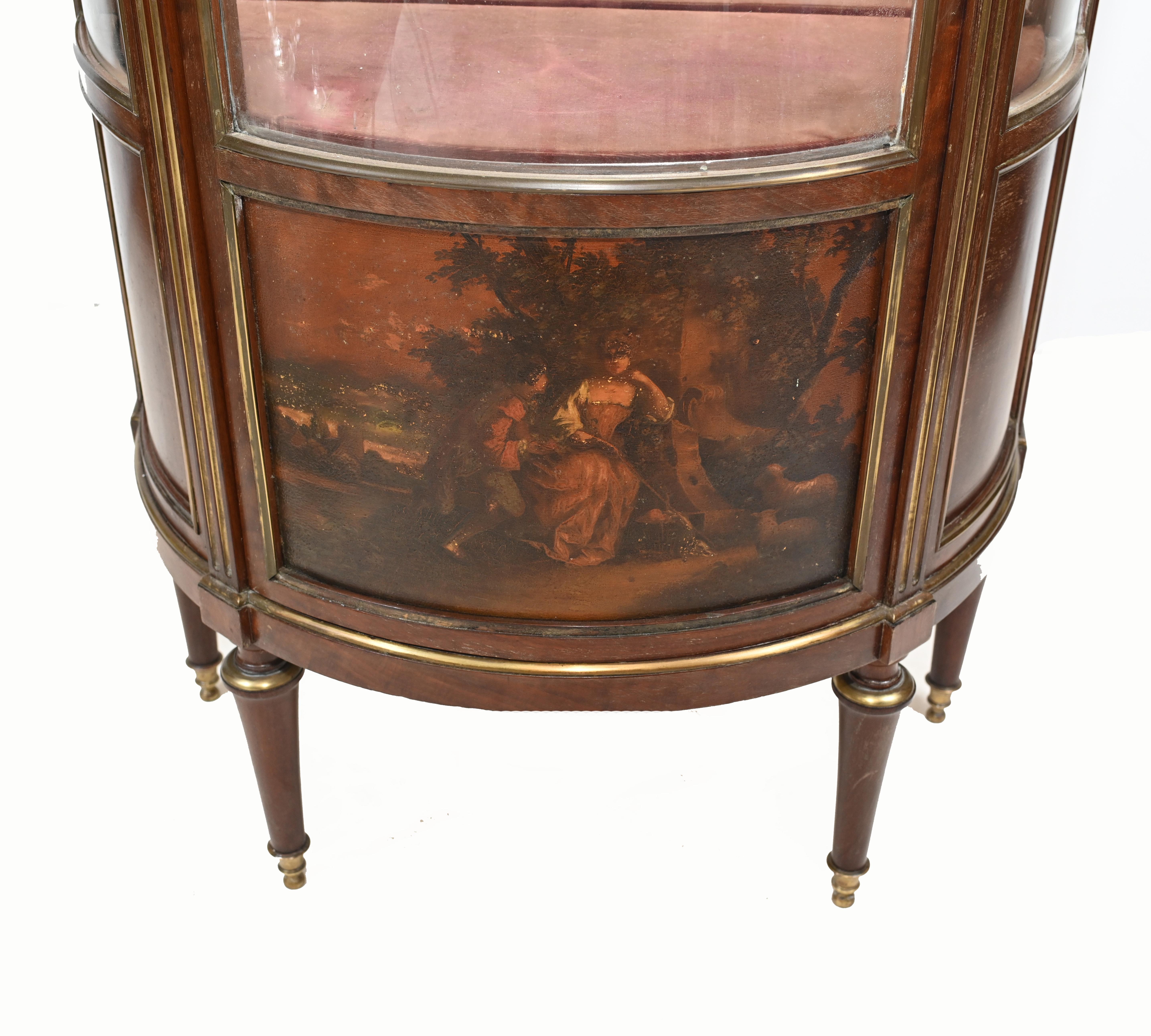 Elegant period French vitrine or display cabinet.
We date this to circa 1870 and it features painted panels in the Vernis Martin manner
Offered in great shape ready for home use right away.
 
 