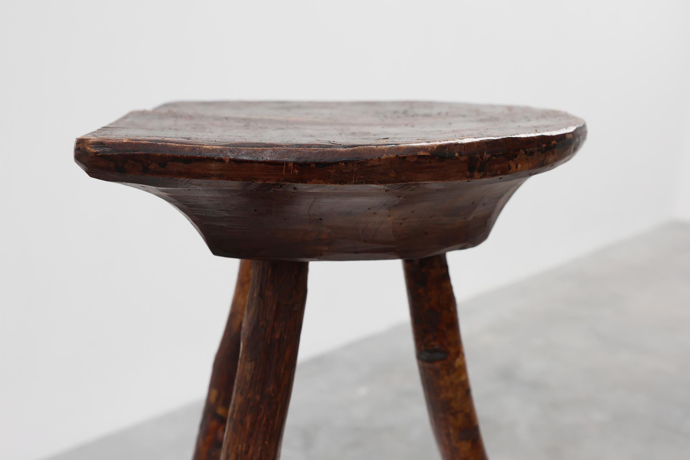 France / 1850 / low stool / wood / Rustic / Antique / brutalist / primitive

Brutalist low wooden stool or tabouret with 3 legs and a half oval-shaped seat. Hand crafted in the mid 19th century in France. With nice patina due to age and a dark