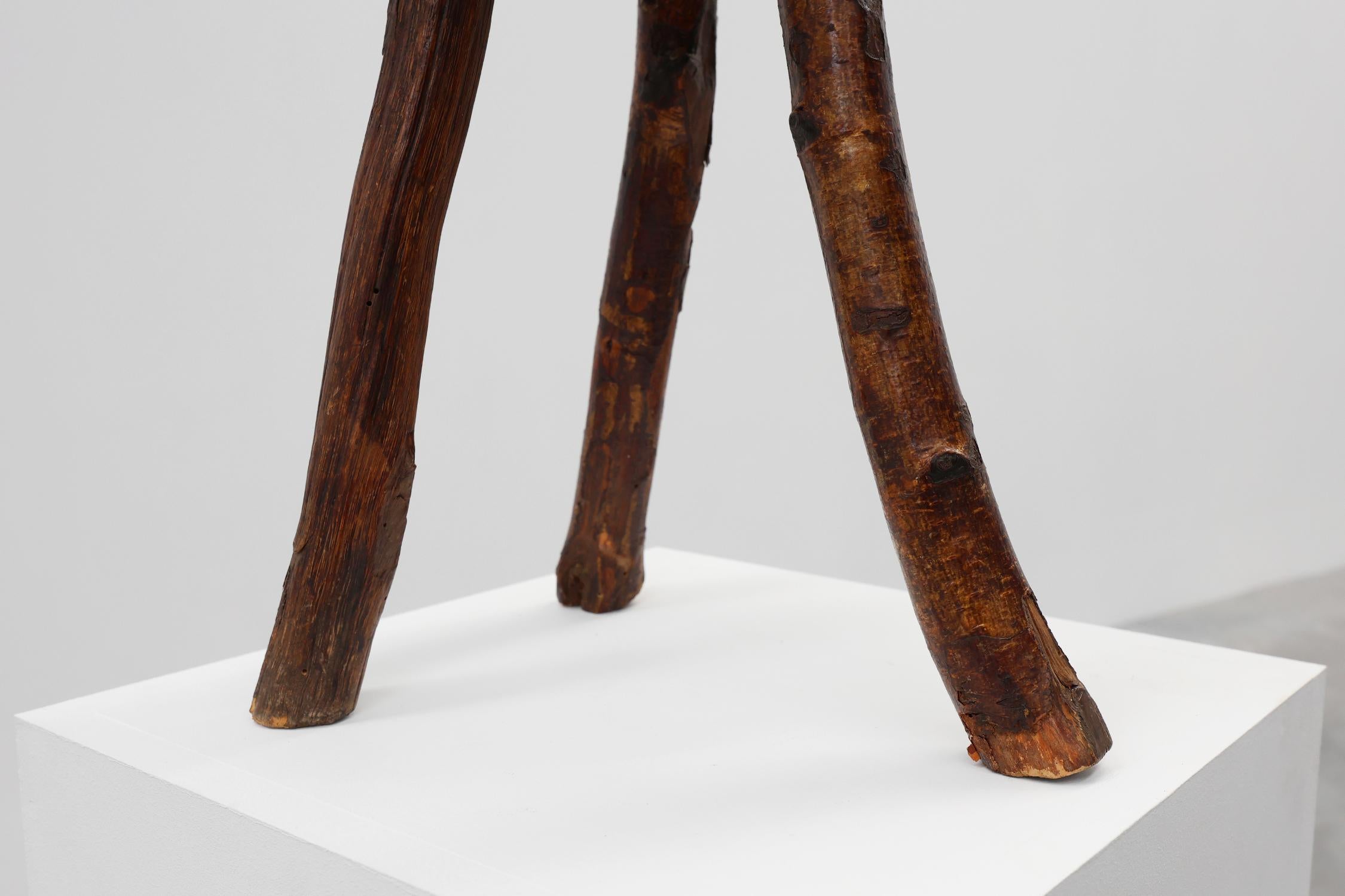 Hand-Carved French wabi sabi low tripod stool in solid wood, 1850s For Sale