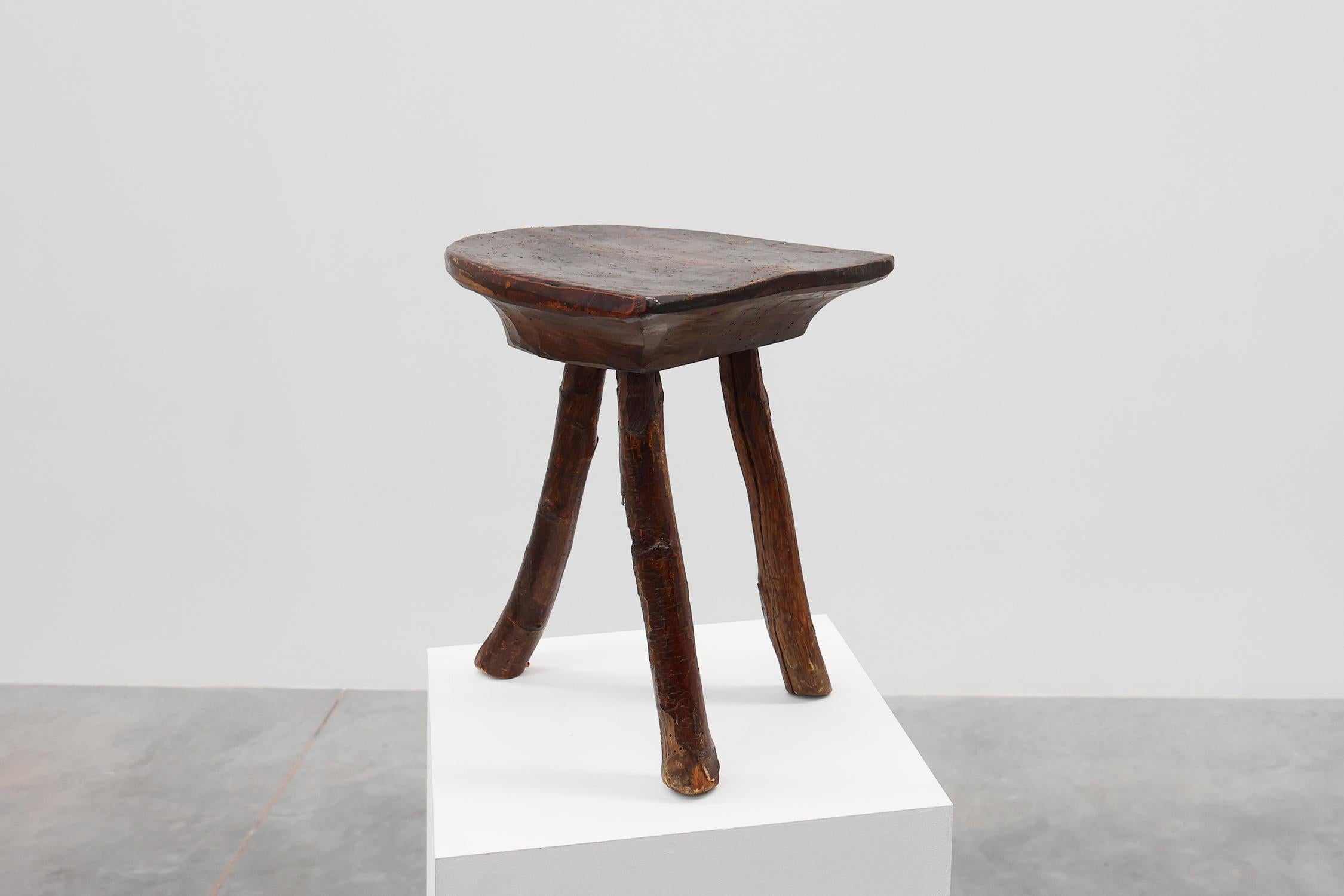 Wood French wabi sabi low tripod stool in solid wood, 1850s For Sale