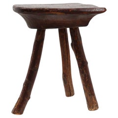 French wabi sabi low tripod stool in solid wood, 1850s