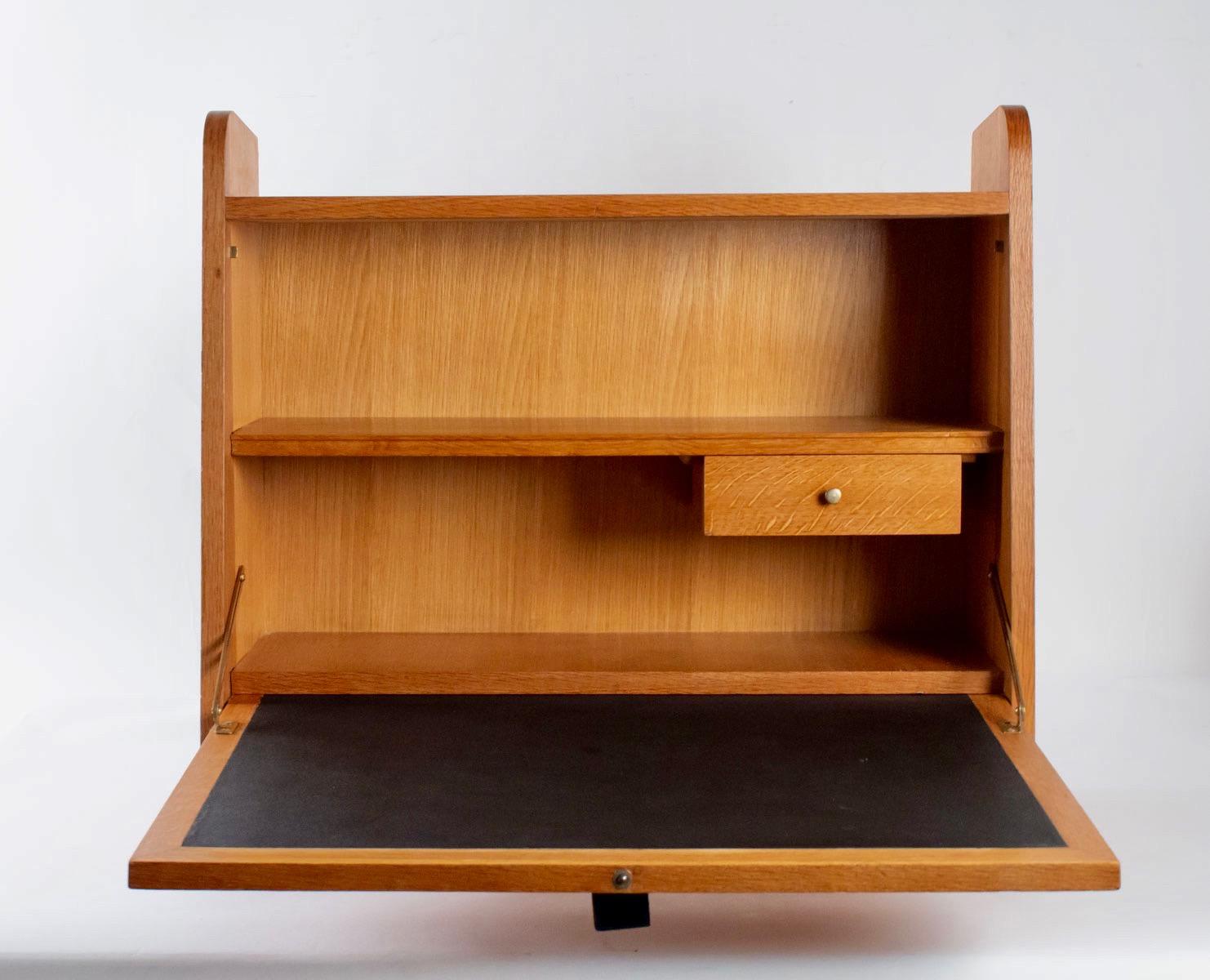 Vintage French design wall cabinet desk designed by Marcel Gascoin for Arhec Eidtor. The organic and simple design breaths 1950s French design. This model is a compact desk easy to fix to walls. The pull-out desk area makes for a comfortable working