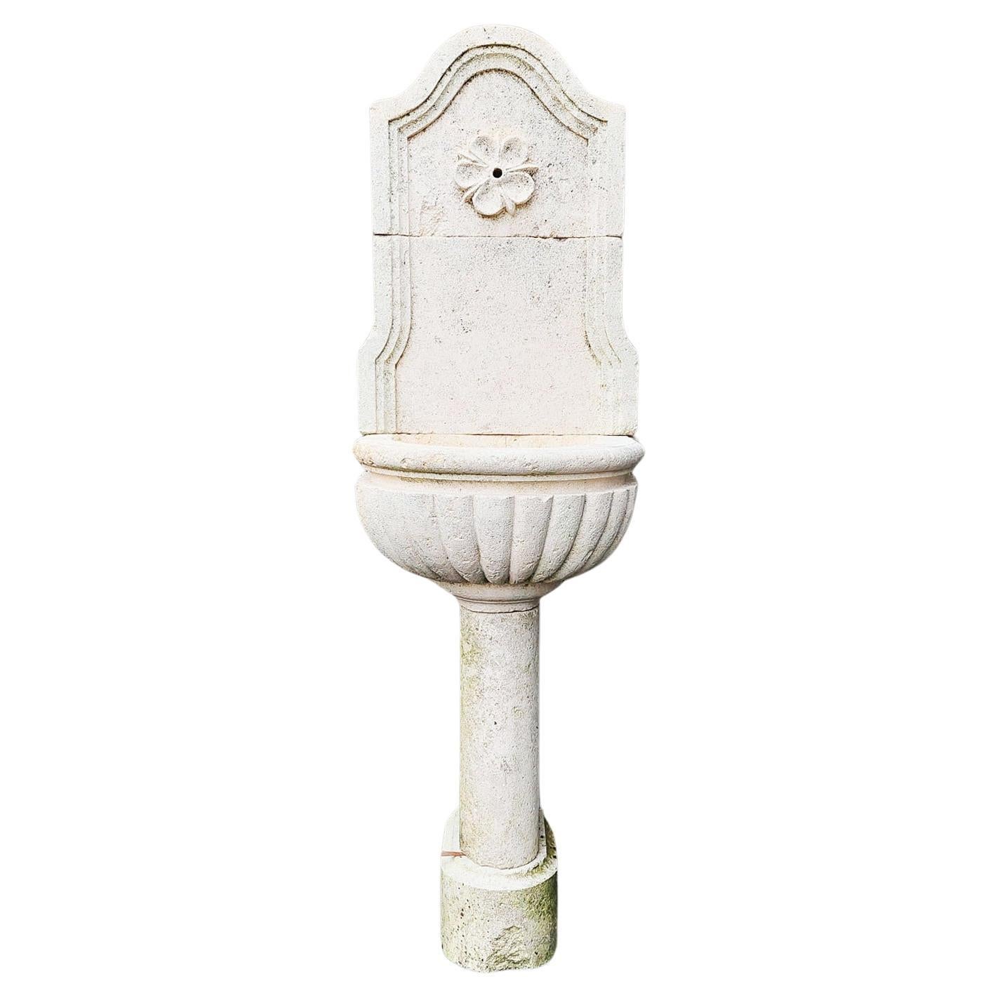 French Wall Fountain made of light Limestone For Sale